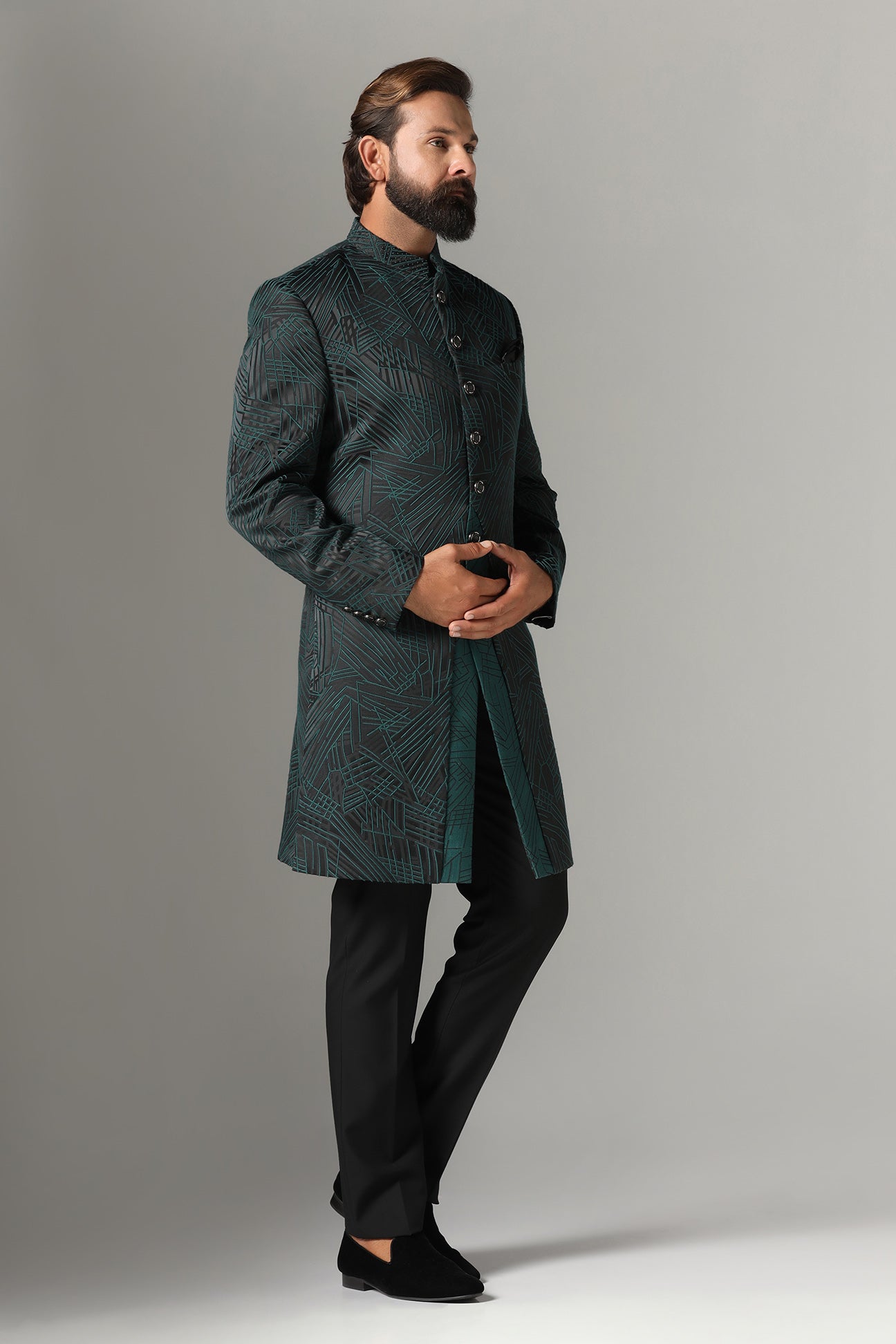 This black Indowestern is highlighted with green line embroidery all across the garment. Shop Now!