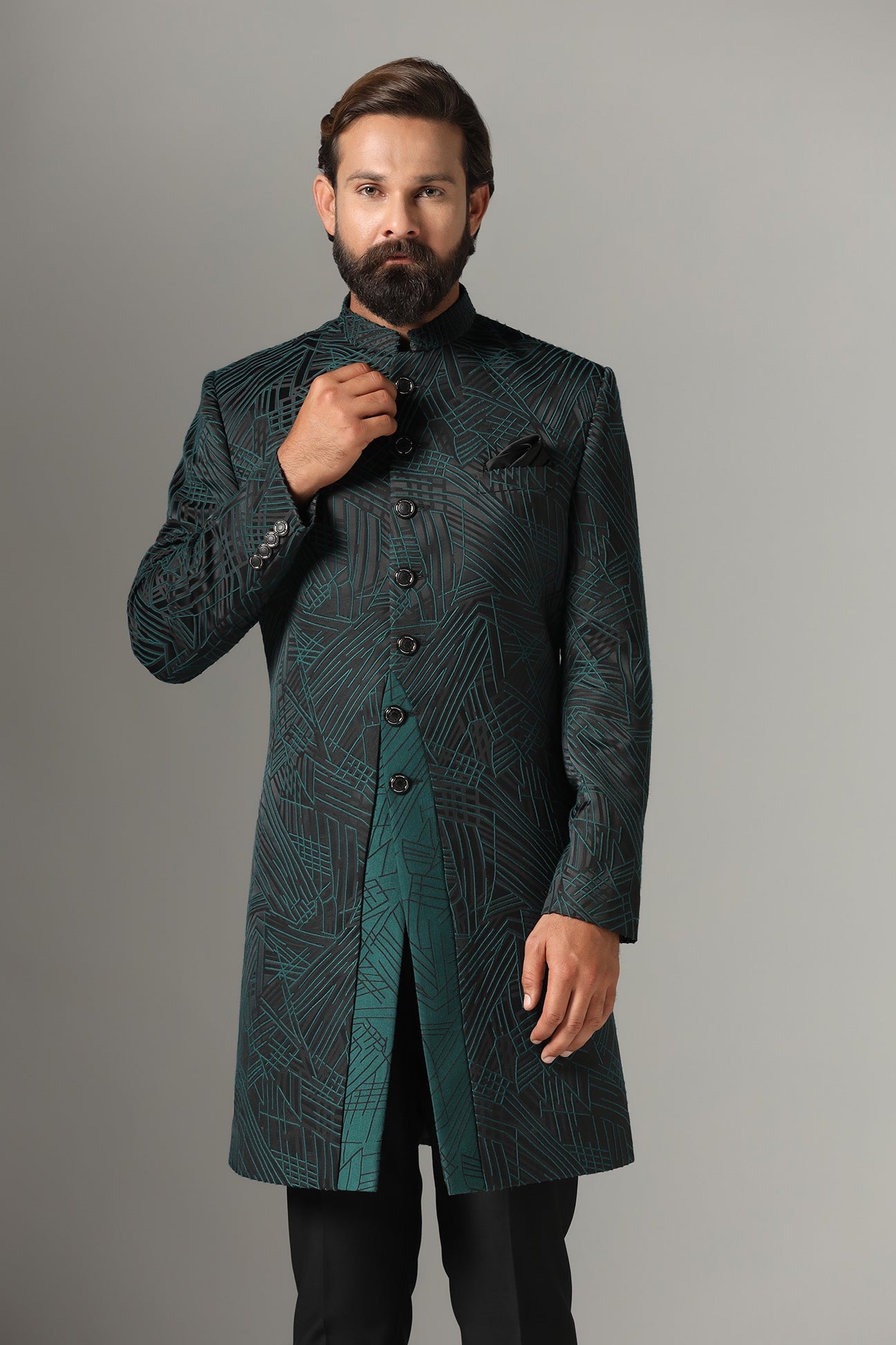 This black Indowestern is highlighted with green line embroidery all across the garment. Shop Now!