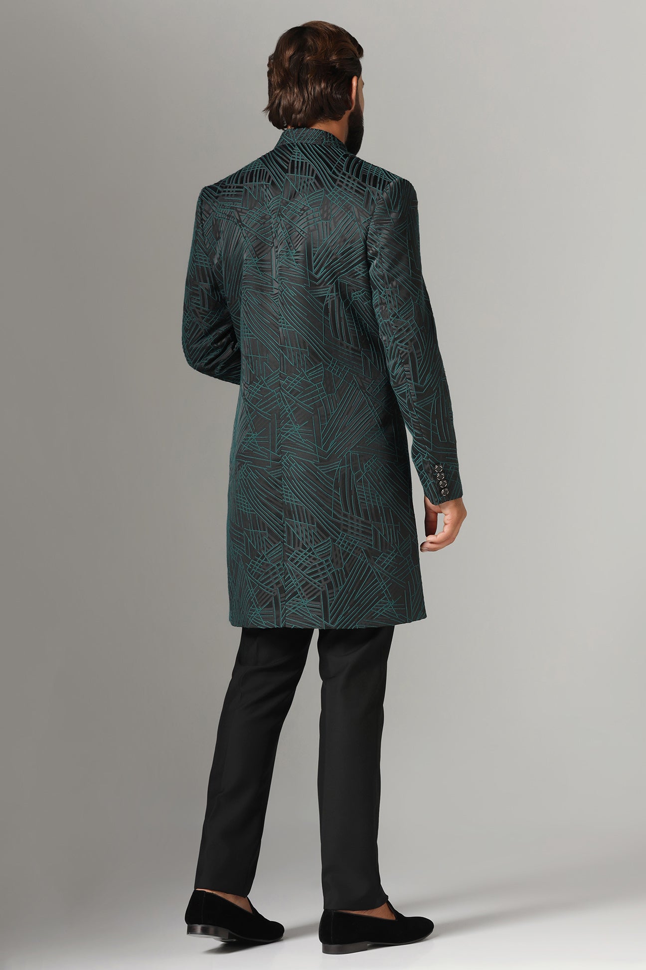 This black Indowestern is highlighted with green line embroidery all across the garment. Shop Now!