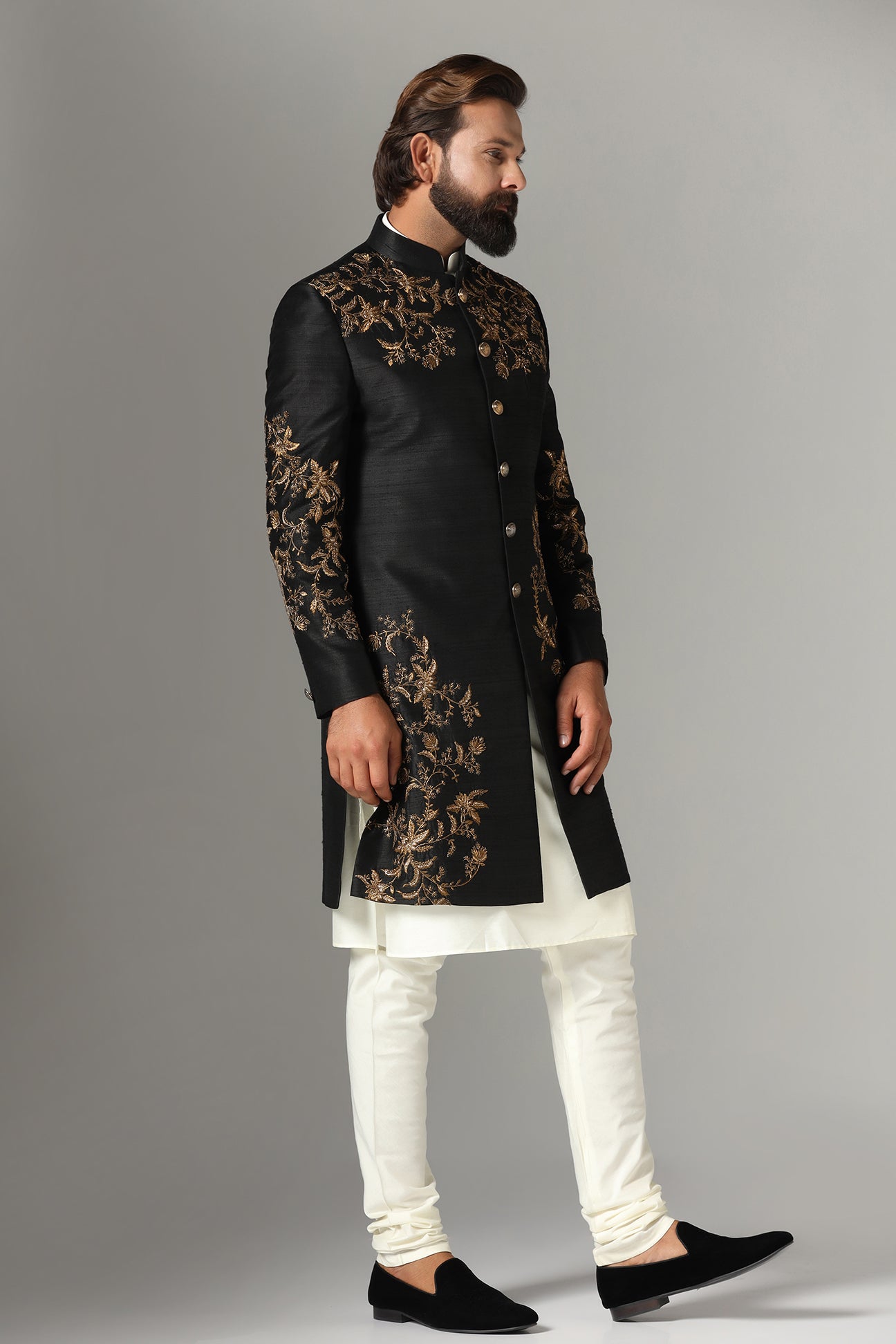 This black raw-silk Indowestern is highlighted with golden embroidery. Shop Now!