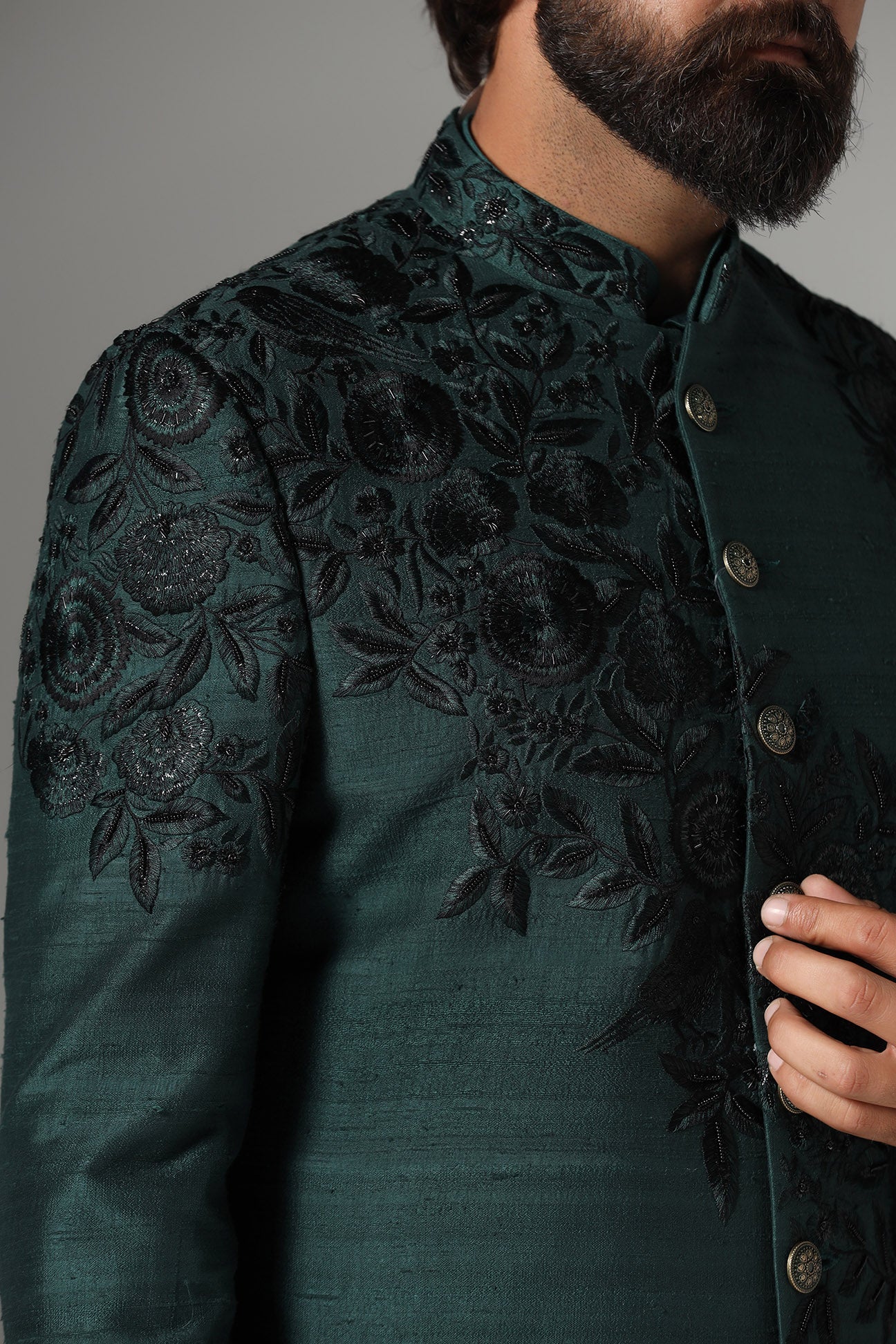 This green Indo-Western features tonal embroidery on the garment. Shop Now!