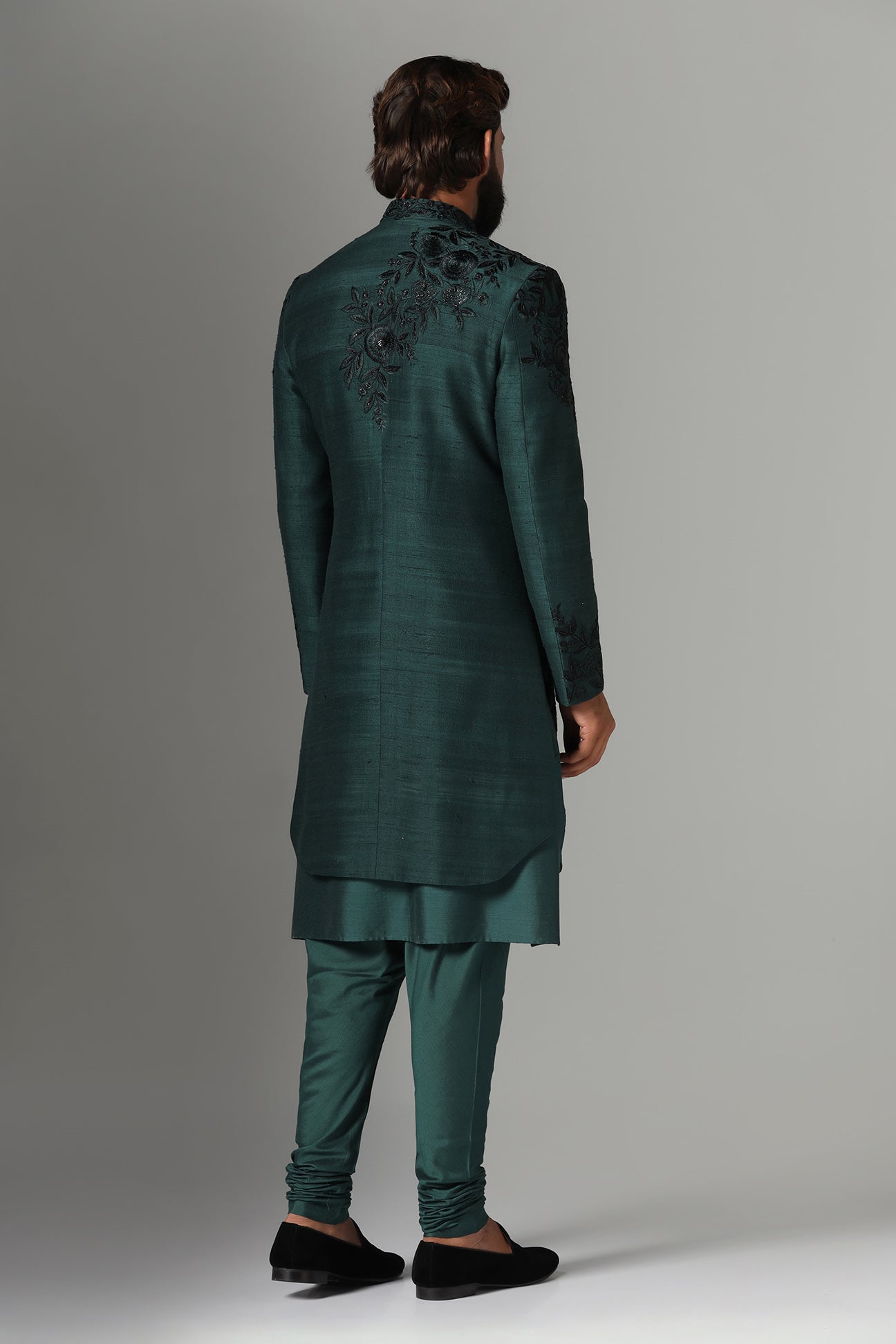 This green Indo-Western features tonal embroidery on the garment. Shop Now!