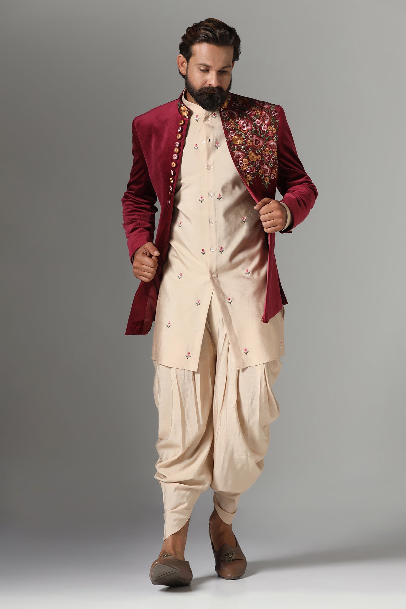 This Indo-Western features multi-coloured floral embroidery on the collar and left panel. Shop Now!