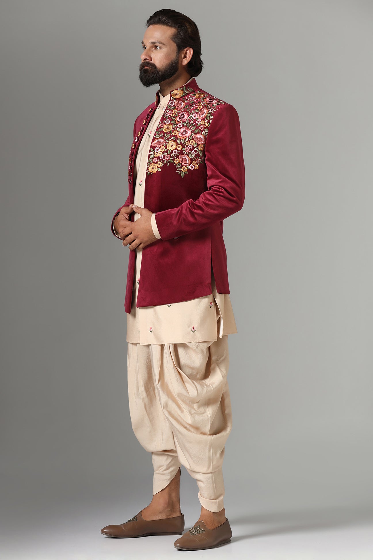This Indo-Western features multi-coloured floral embroidery on the collar and left panel. Shop Now!