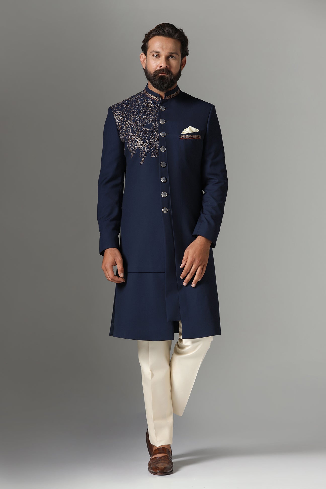 This navy blue Indo-western features golden embroidery on the collar and right panel. Shop Now!