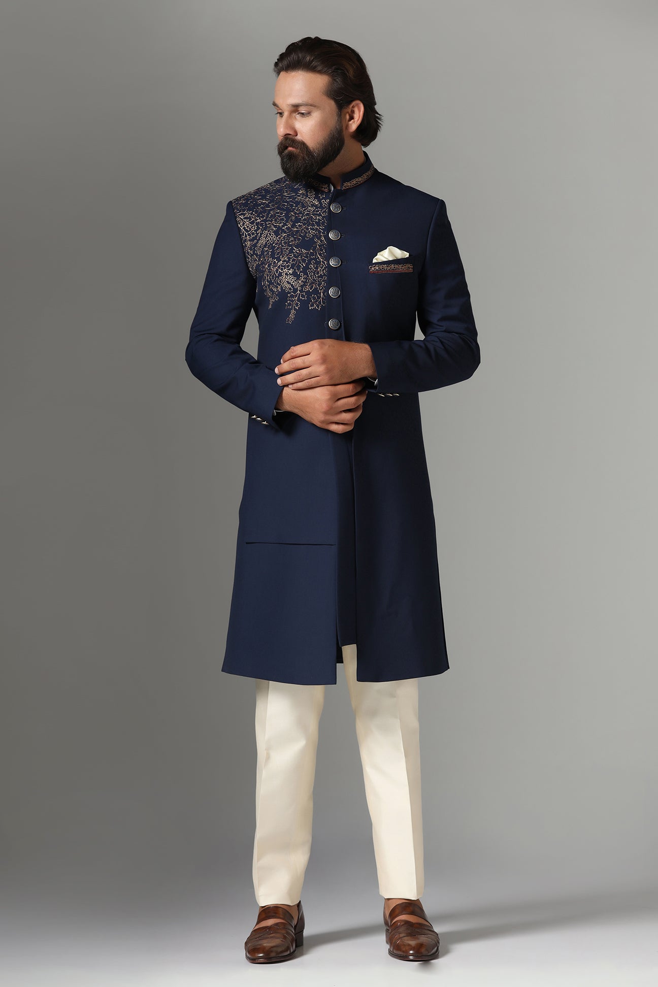This navy blue Indo-western features golden embroidery on the collar and right panel. Shop Now!