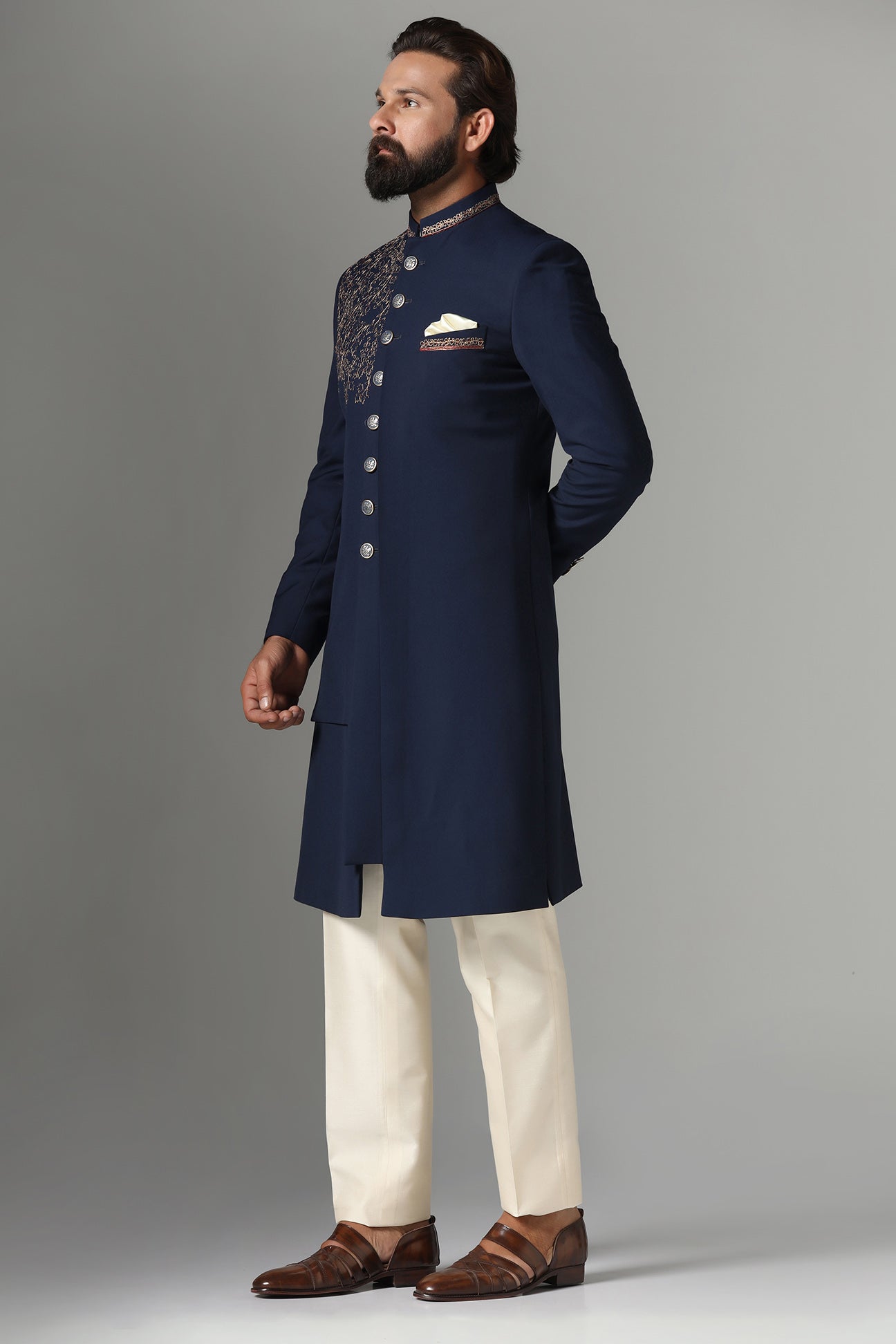 This navy blue Indo-western features golden embroidery on the collar and right panel. Shop Now!