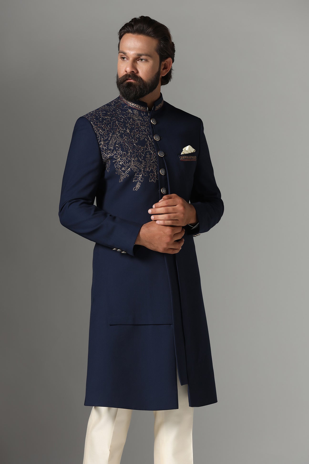 This navy blue Indo-western features golden embroidery on the collar and right panel. Shop Now!