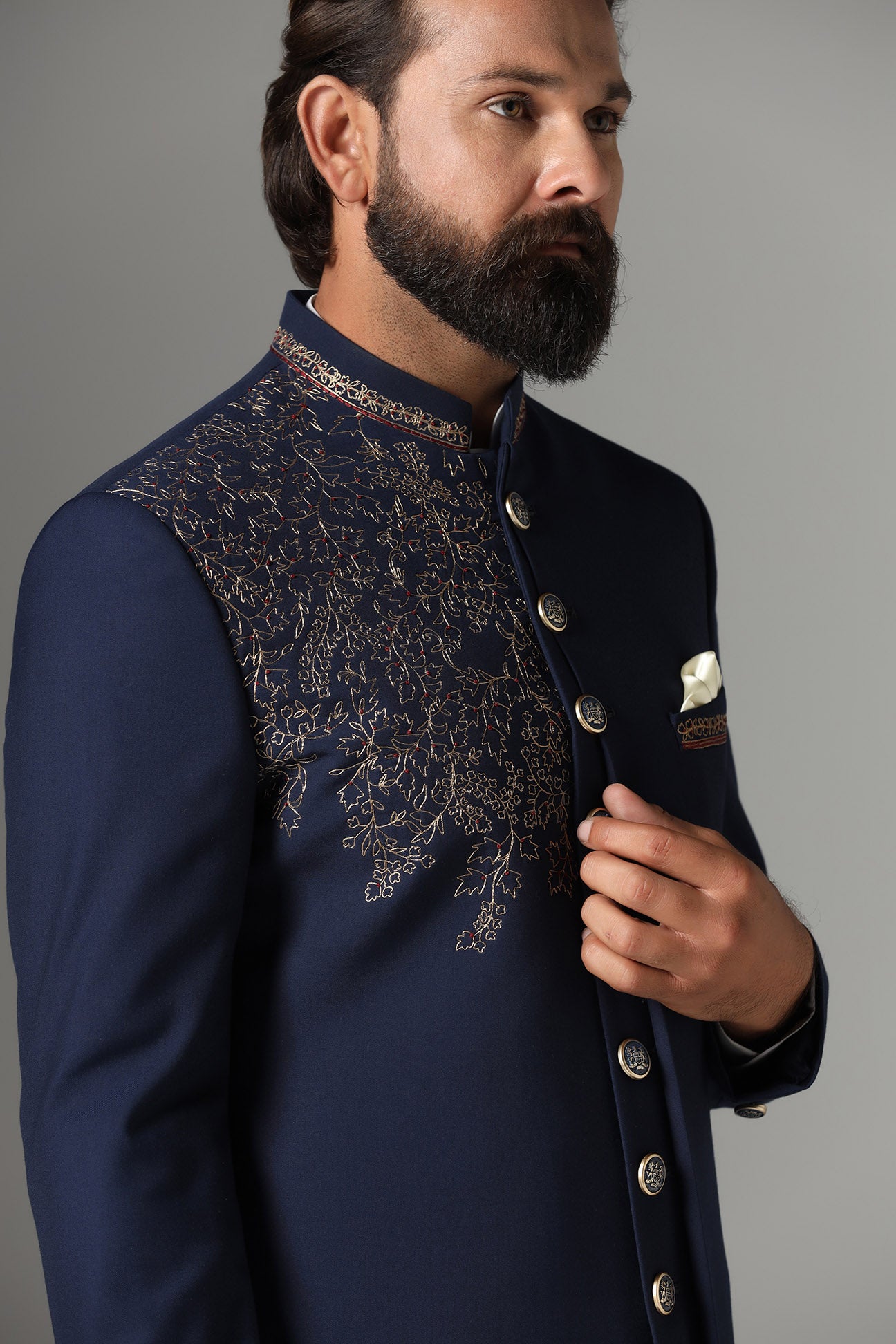 This navy blue Indo-western features golden embroidery on the collar and right panel. Shop Now!