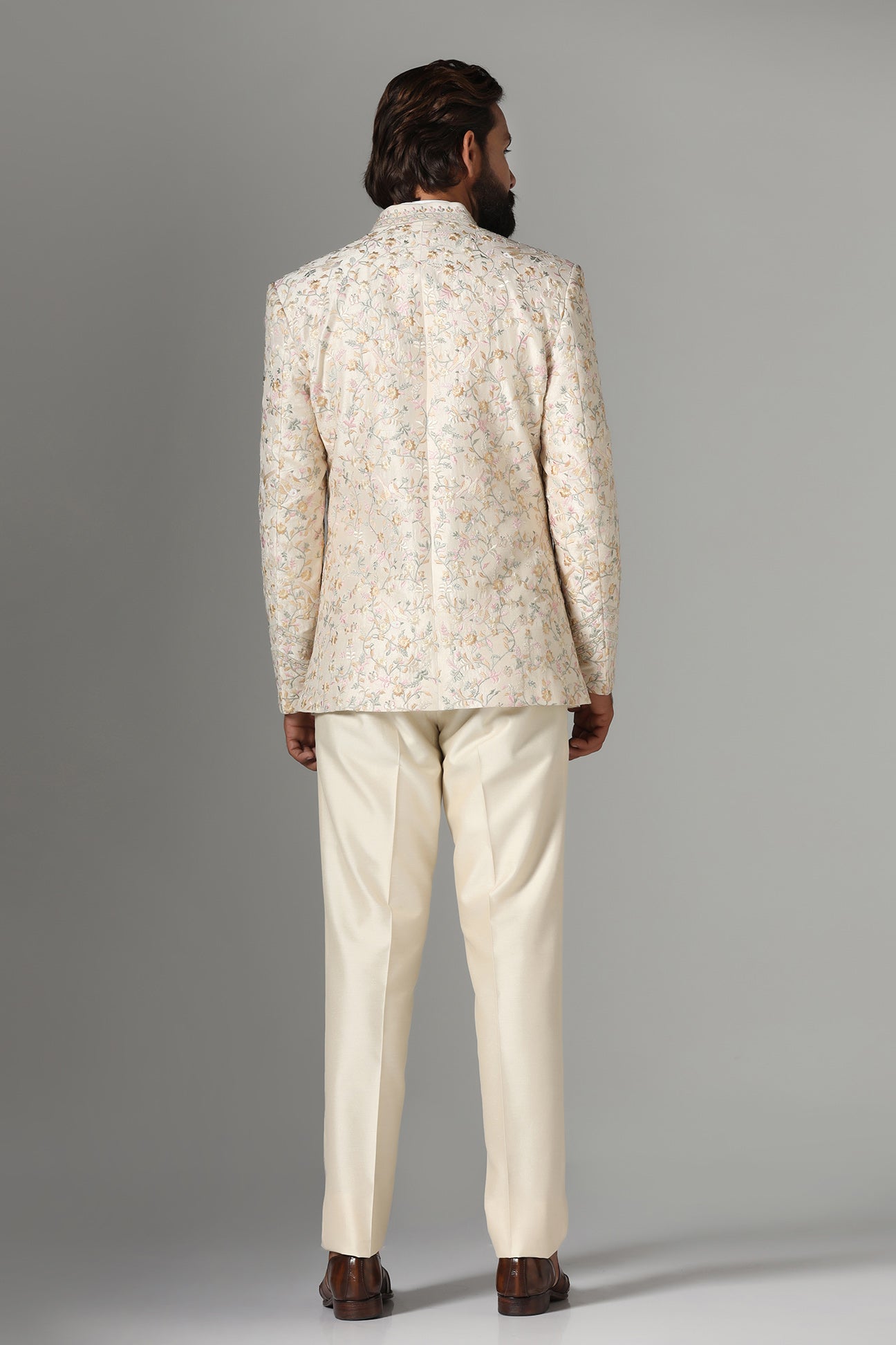 Unveil timeless elegance with the Off-White Embroidered Bandhgala Suit from Brahaan Store. Shop now!