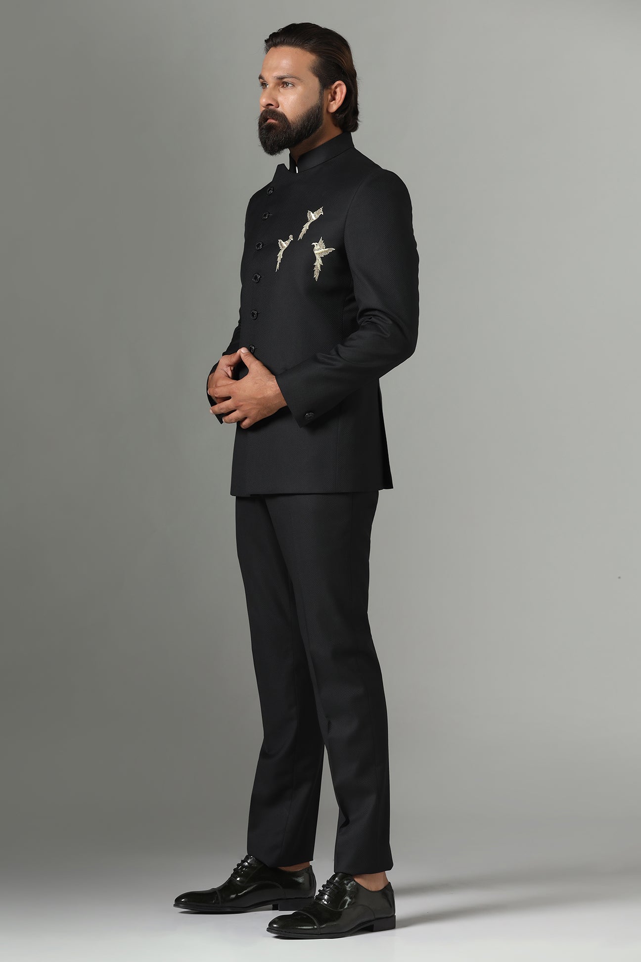 Asymmetric Black Bandhgala suit crafted from wool-rich fabric. Shop now!