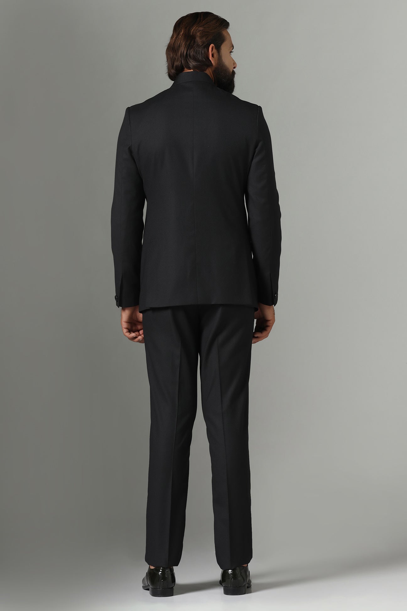 Asymmetric Black Bandhgala suit crafted from wool-rich fabric. Shop now!