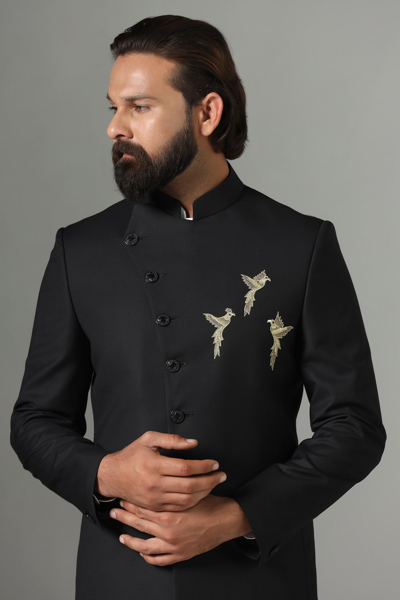 Asymmetric Black Bandhgala suit crafted from wool-rich fabric. Shop now!