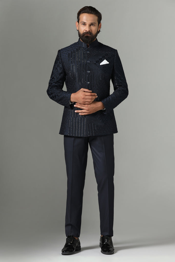 Elevate your style with our Navy blue Bandhgala suit, adorned with delicate embroidery. Complete with Polo trousers for a refined ensemble.