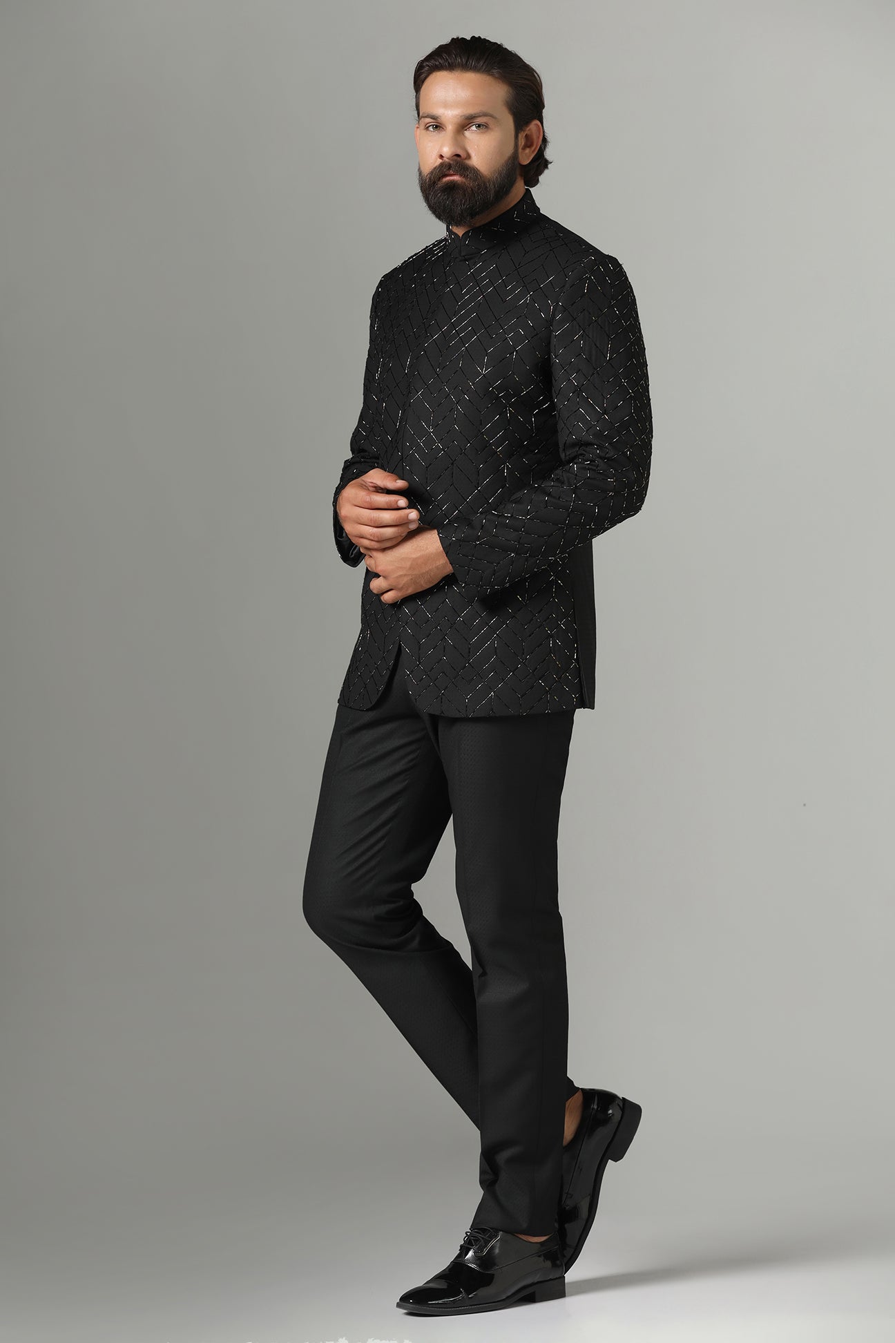 Shop the classic black Bandhgala suit with intricate embroidery for a sophisticated look. Shop now!