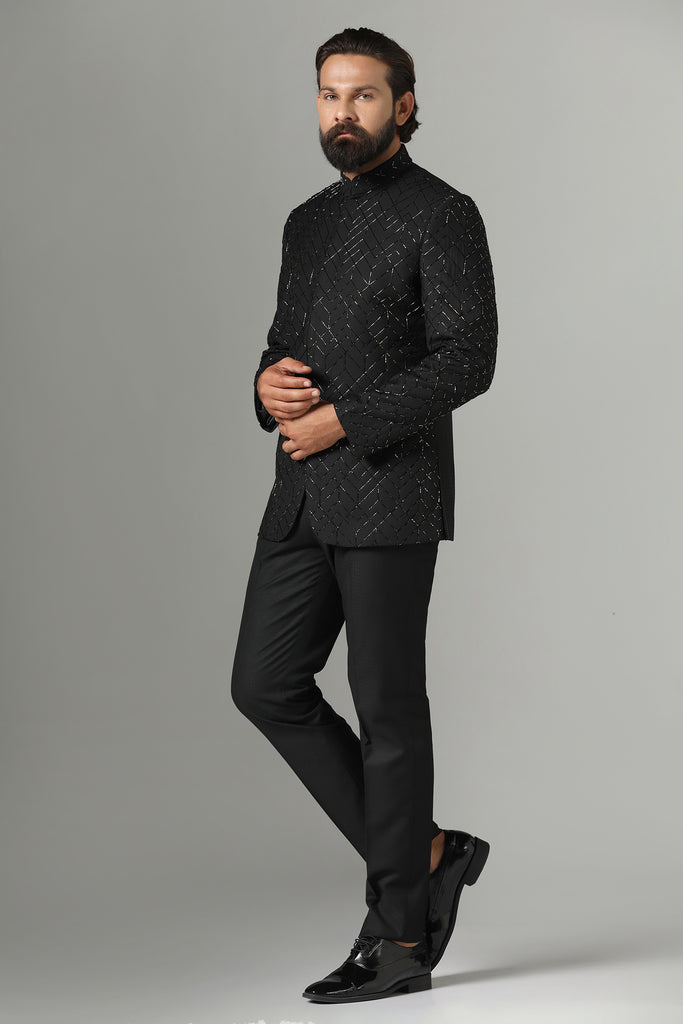 Dress with sophistication in our Black Bandhgala suit, tailored from wool-rich fabric and delicately embroidered in a geometric pattern. Paired with Polo trousers for a refined look.