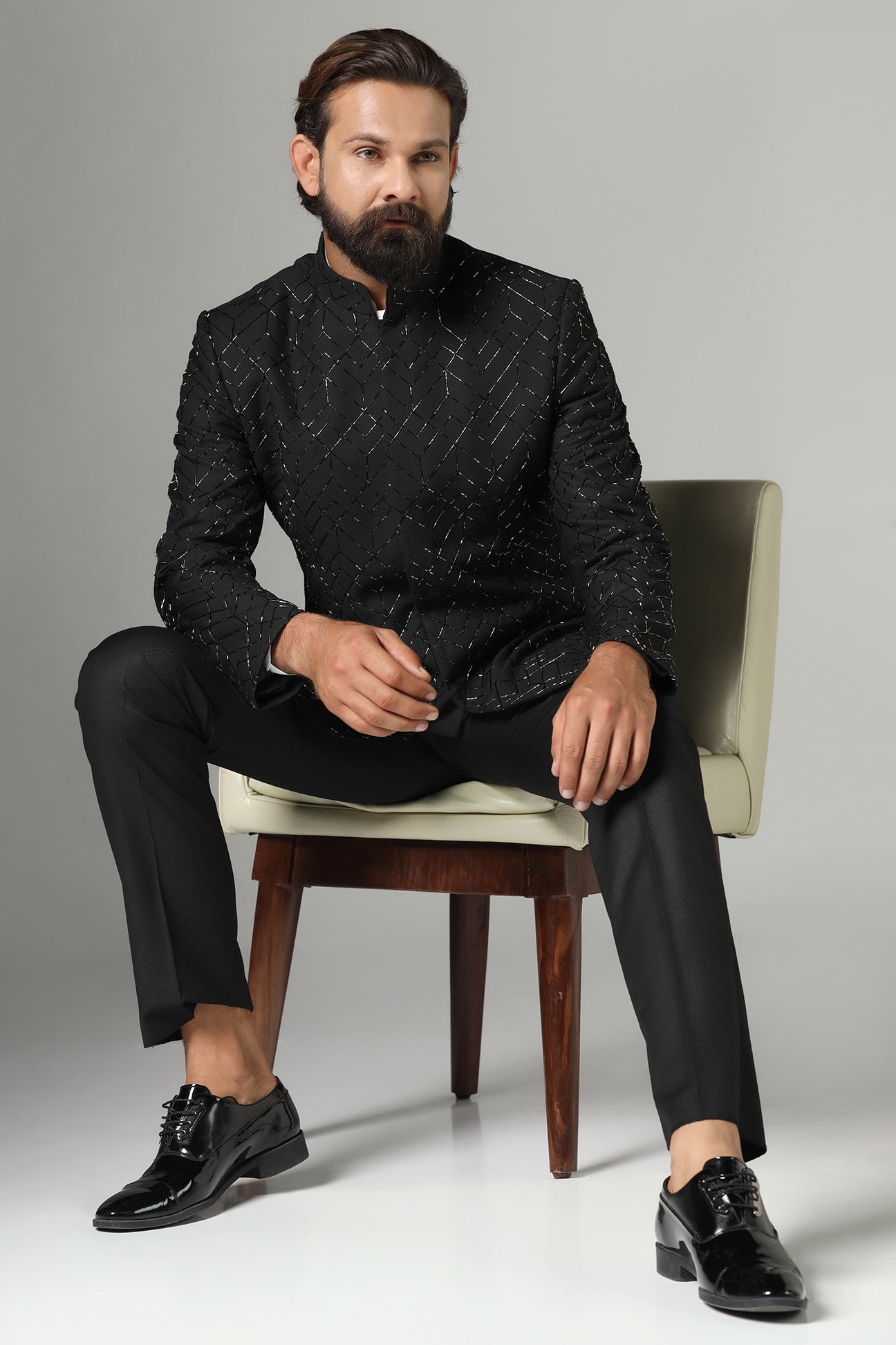 Shop the classic black Bandhgala suit with intricate embroidery for a sophisticated look. Shop now!