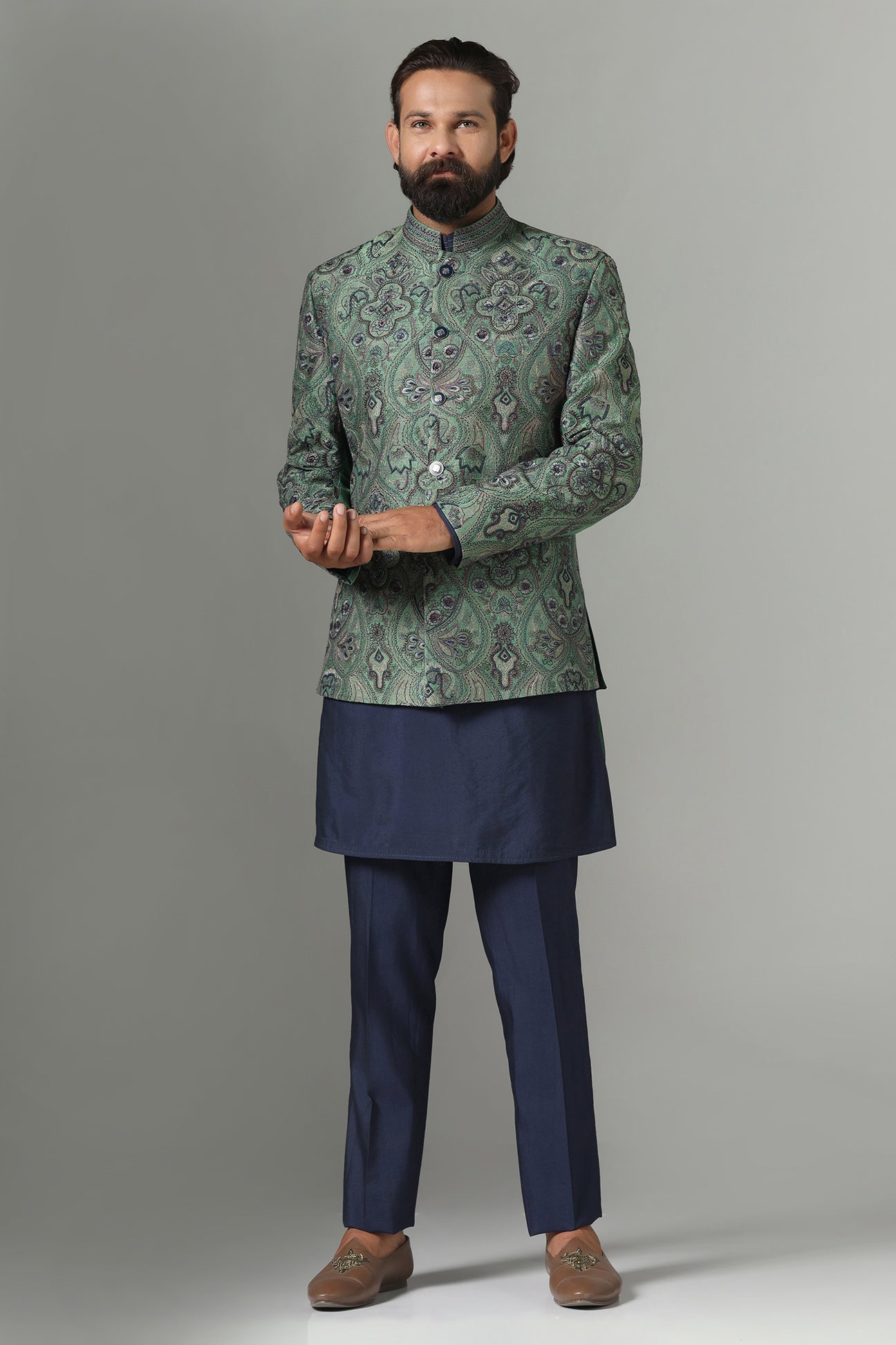 Shop the stylish green Bandhgala suit with intricate embroidery for a refined look. Shop now!