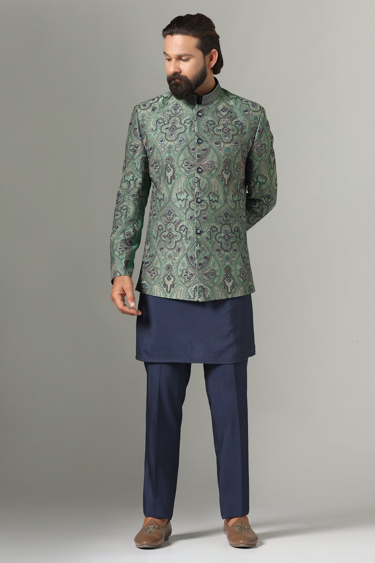 Shop the stylish green Bandhgala suit with intricate embroidery for a refined look. Shop now!