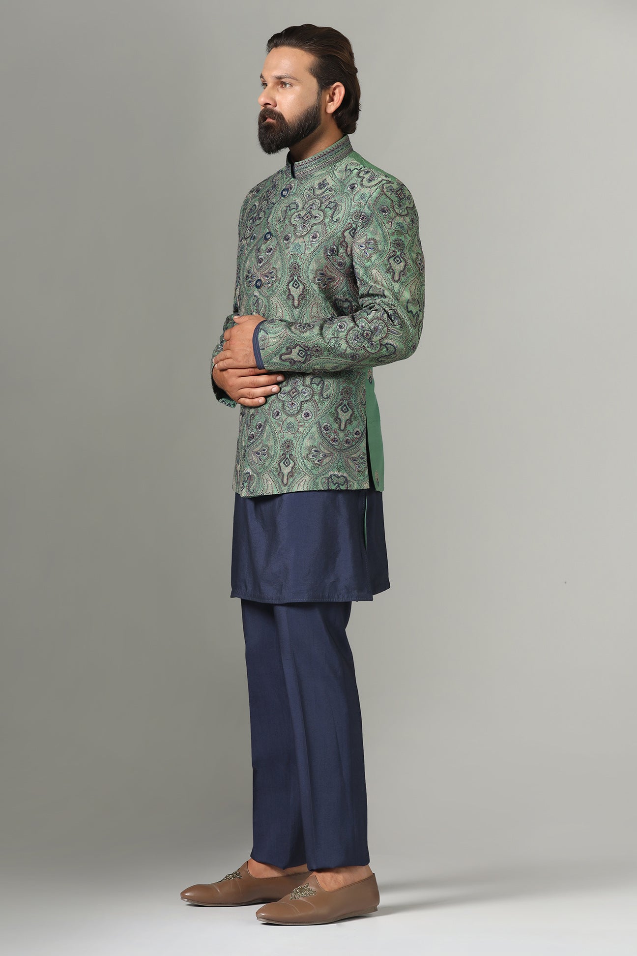 Shop the stylish green Bandhgala suit with intricate embroidery for a refined look. Shop now!