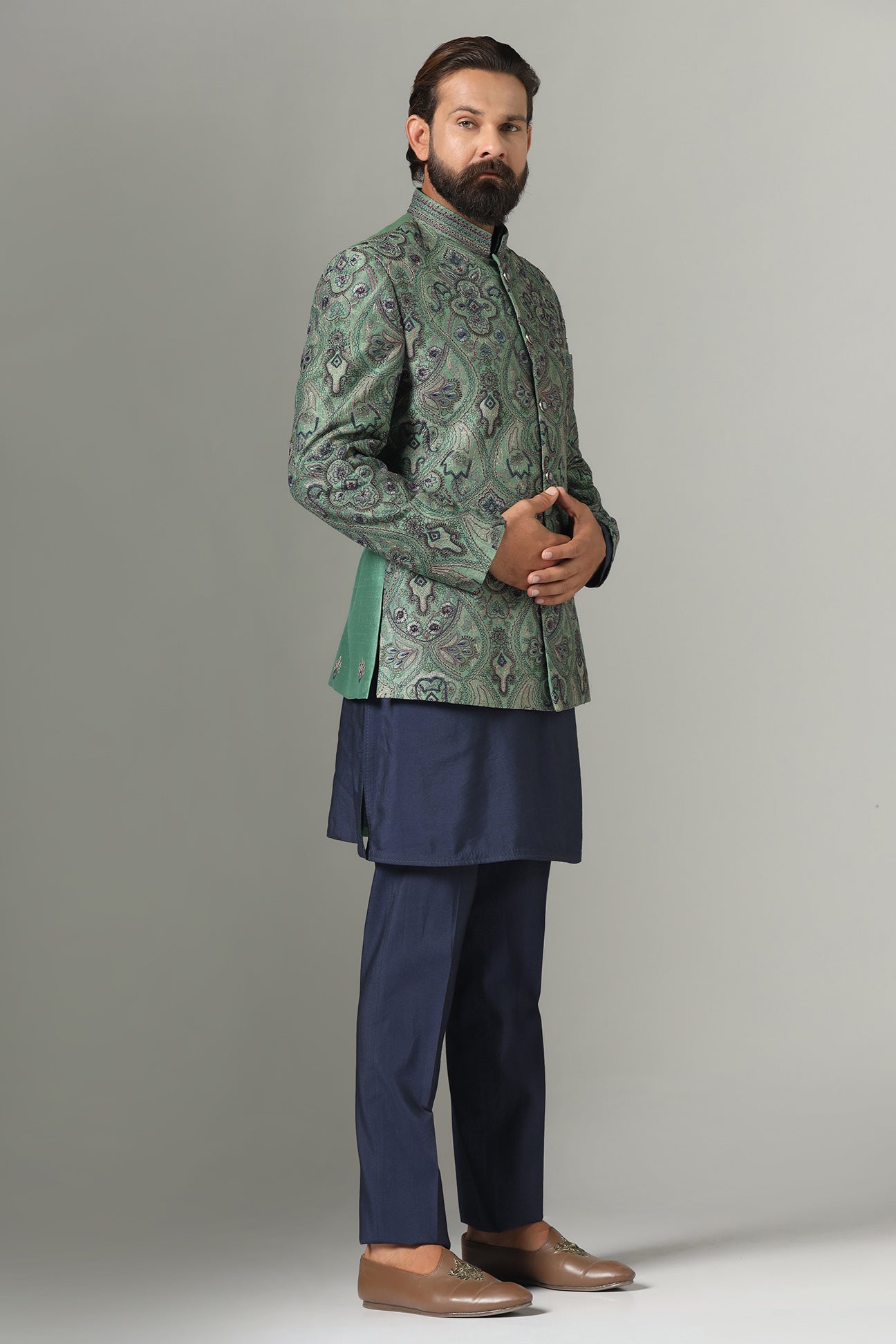 Shop the stylish green Bandhgala suit with intricate embroidery for a refined look. Shop now!