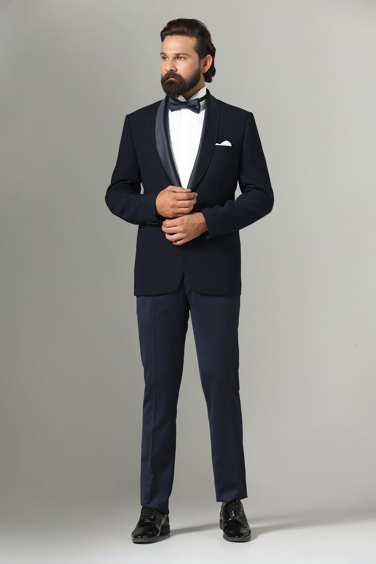 Distinguished elegance in our Dark Blue Textured Tuxedo. Shop Now!