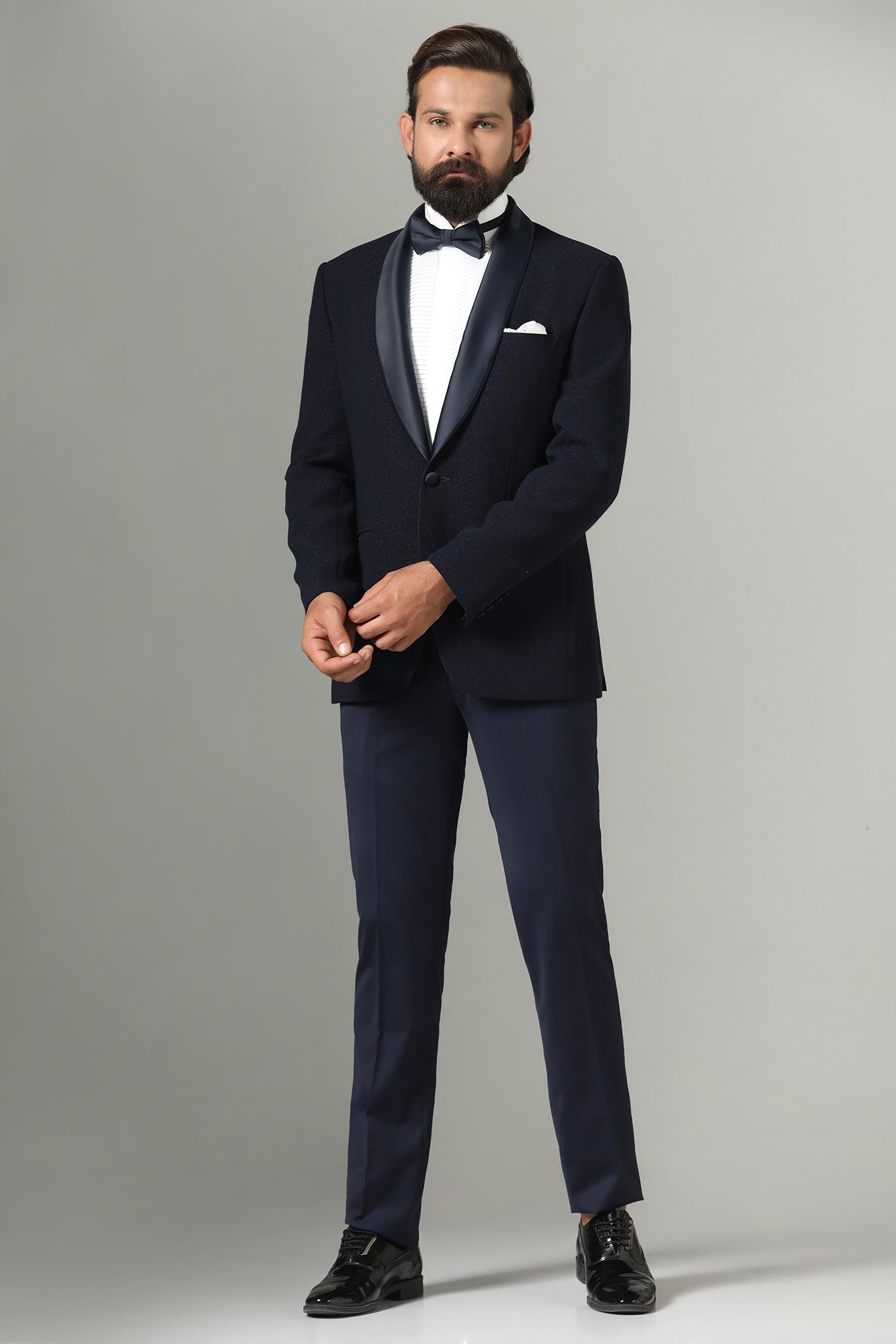 Distinguished elegance in our Dark Blue Textured Tuxedo. Shop Now!