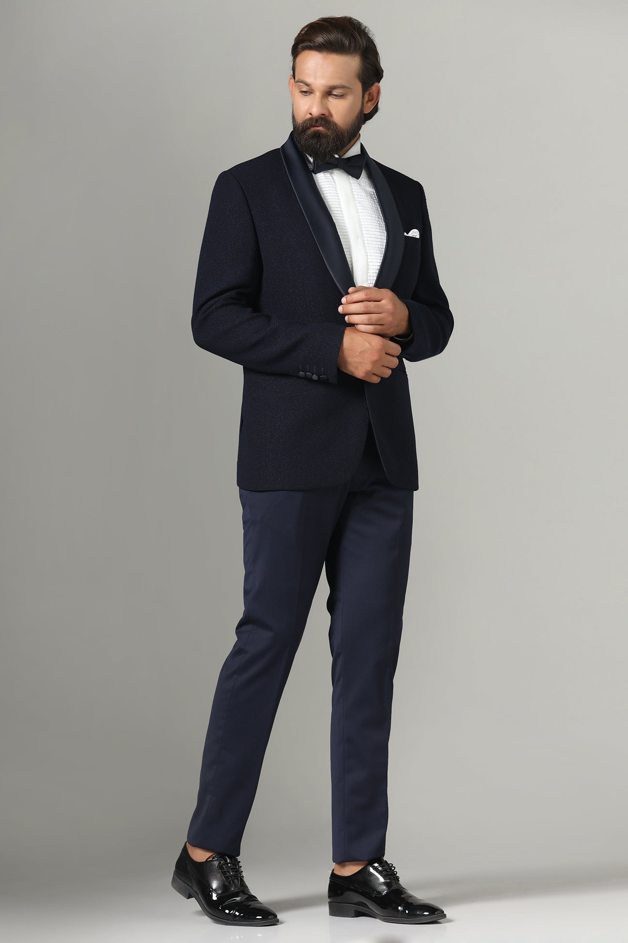 Distinguished elegance in our Dark Blue Textured Tuxedo. Shop Now!