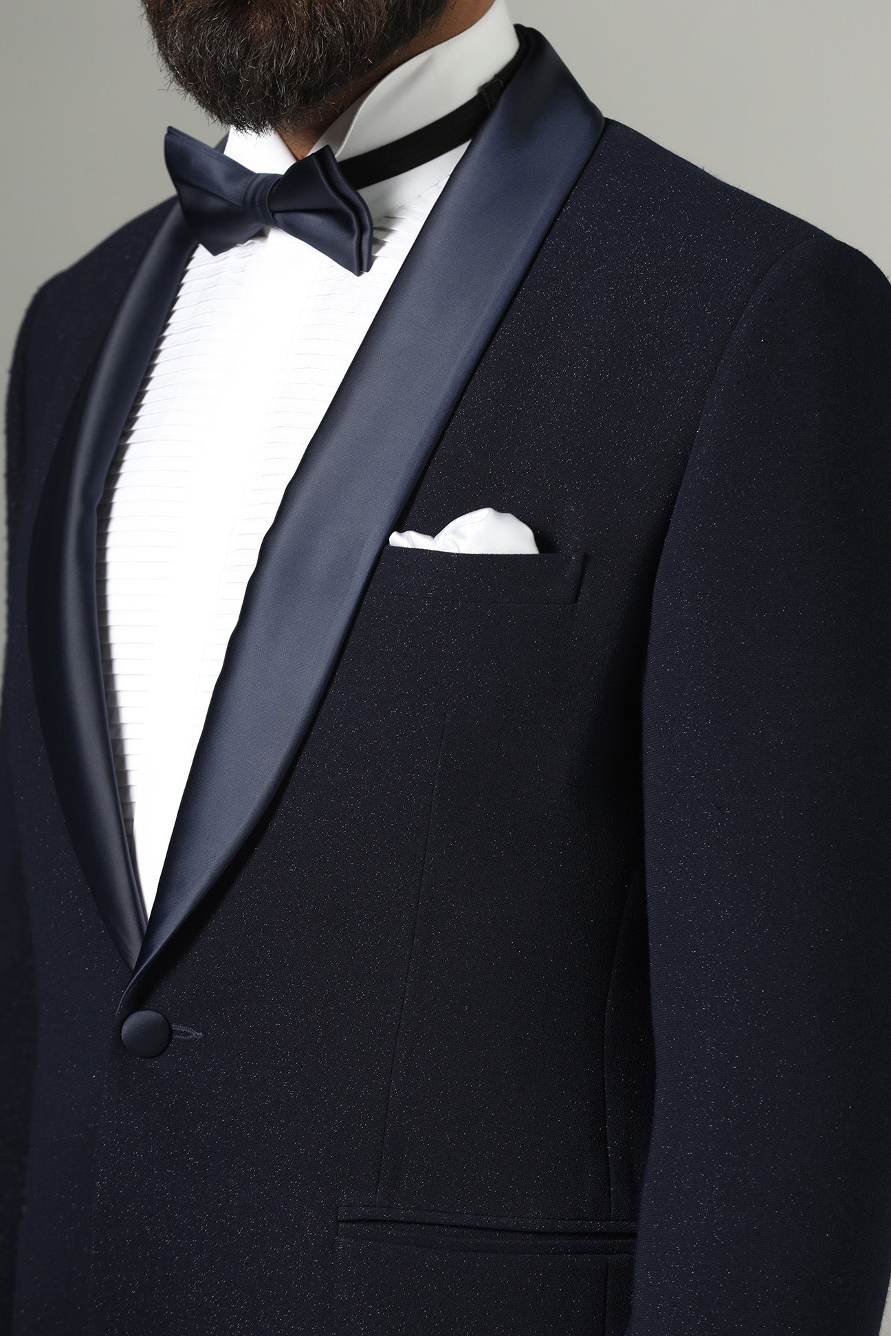 Distinguished elegance in our Dark Blue Textured Tuxedo. Shop Now!