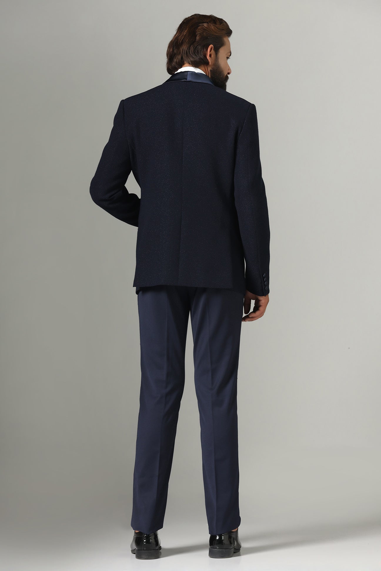 Distinguished elegance in our Dark Blue Textured Tuxedo. Shop Now!