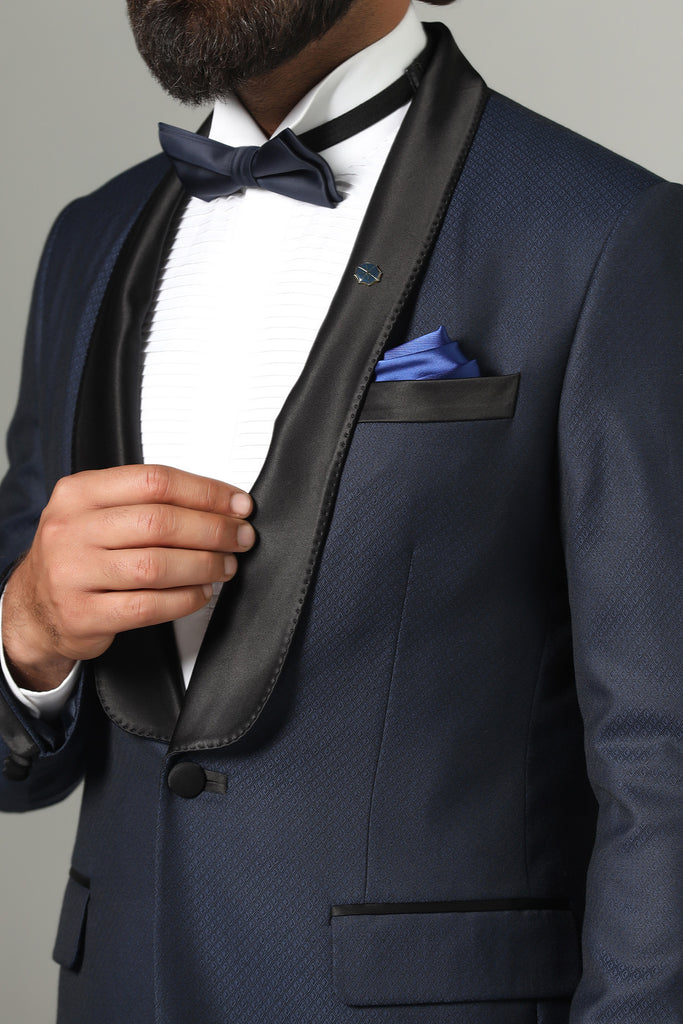 Revitalize your formal look with our Contemporary Tuxedo. Innovative shawl lapel design. Crafted from luxurious Italian wool fabric with subtle texture.