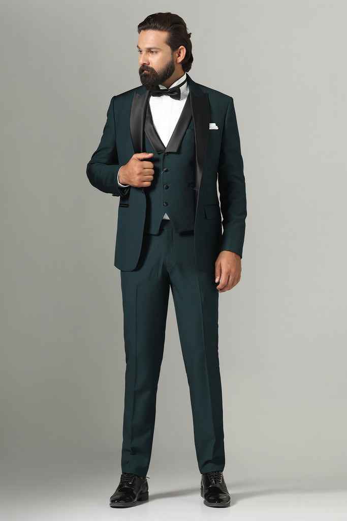 Elevate your style with our Bottle Green Tuxedo. Notched lapel, single-button closure. Paired with matching waistcoat and trousers for a polished look.