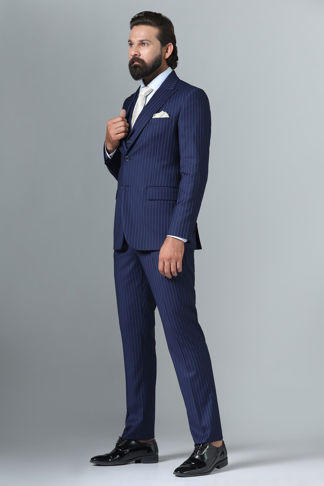 Distinguish your look with our Navy Blue Pinstripe Suit. Shop Now!