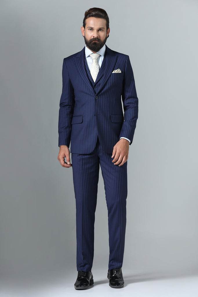 Distinguish your look with our Navy Blue Pinstripe Suit. Crafted from Navy Blue Terry-Rayon Fabric, featuring a peak lapel and a 5-button waistcoat.