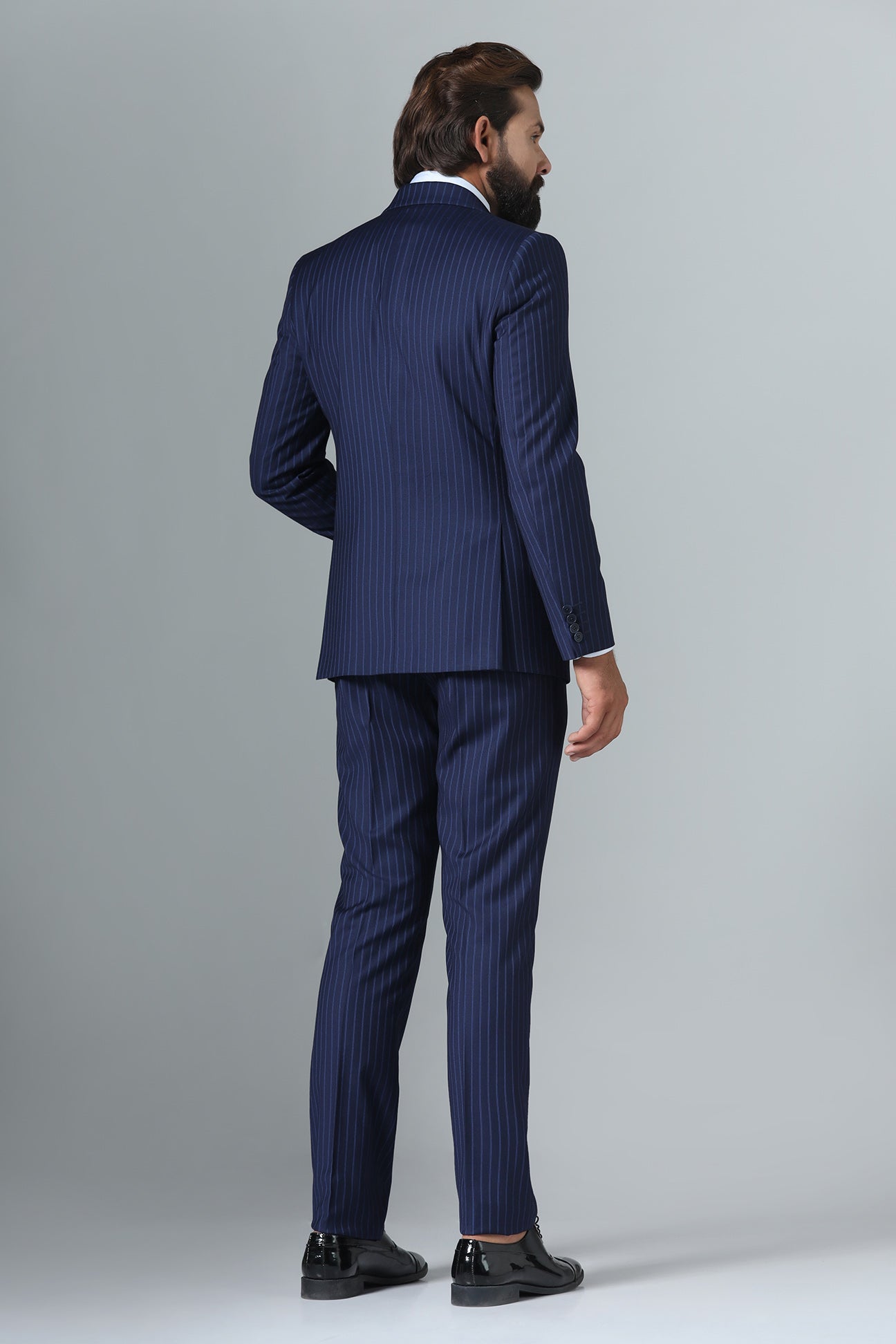 Distinguish your look with our Navy Blue Pinstripe Suit. Shop Now!