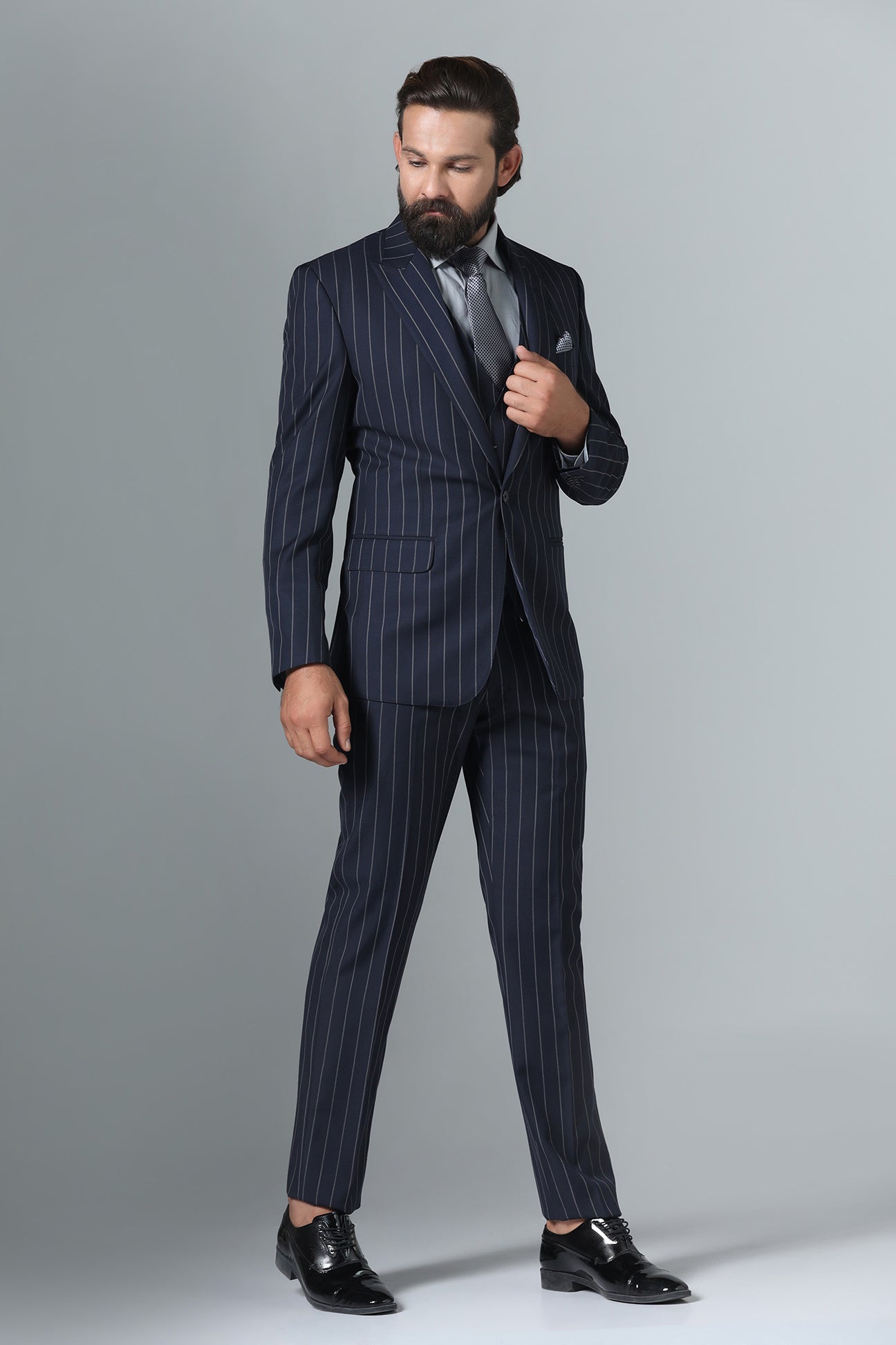 Elevate your formal attire with our Dark Blue Pinstripe Suit. Shop Now!
