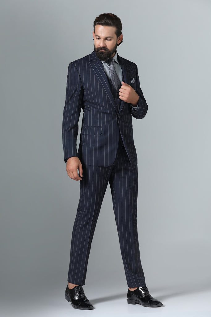 Elevate your formal attire with our Dark Blue Pinstripe Suit. Crafted from wool-rich fabric, peak lapel, double-breasted waistcoat. Complete ensemble with matching pant.