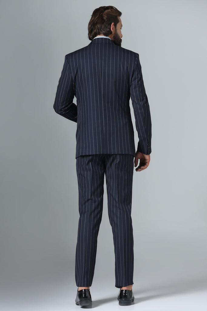 Elevate your formal attire with our Dark Blue Pinstripe Suit. Crafted from wool-rich fabric, peak lapel, double-breasted waistcoat. Complete ensemble with matching pant.