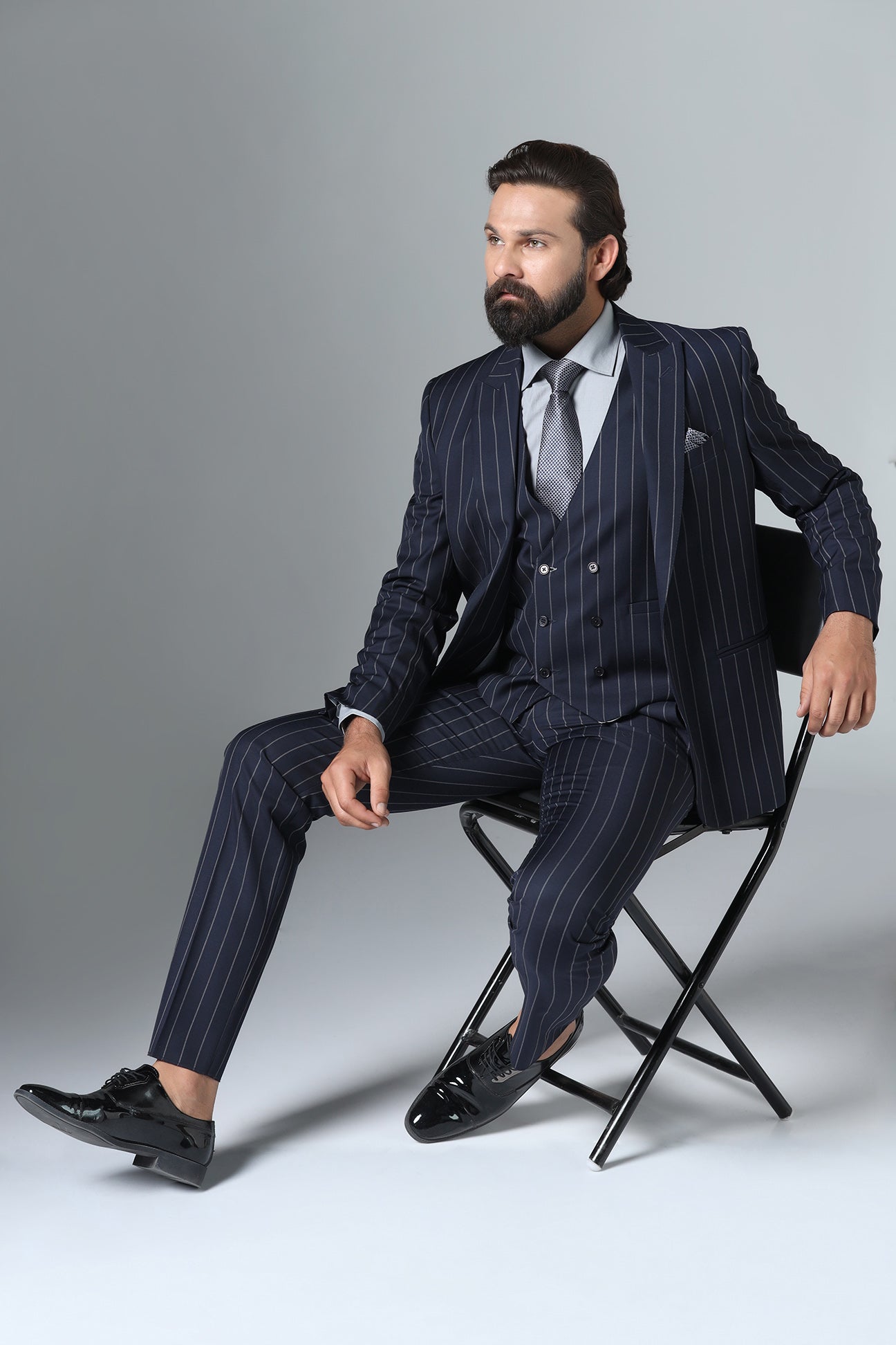 Elevate your formal attire with our Dark Blue Pinstripe Suit. Shop Now!