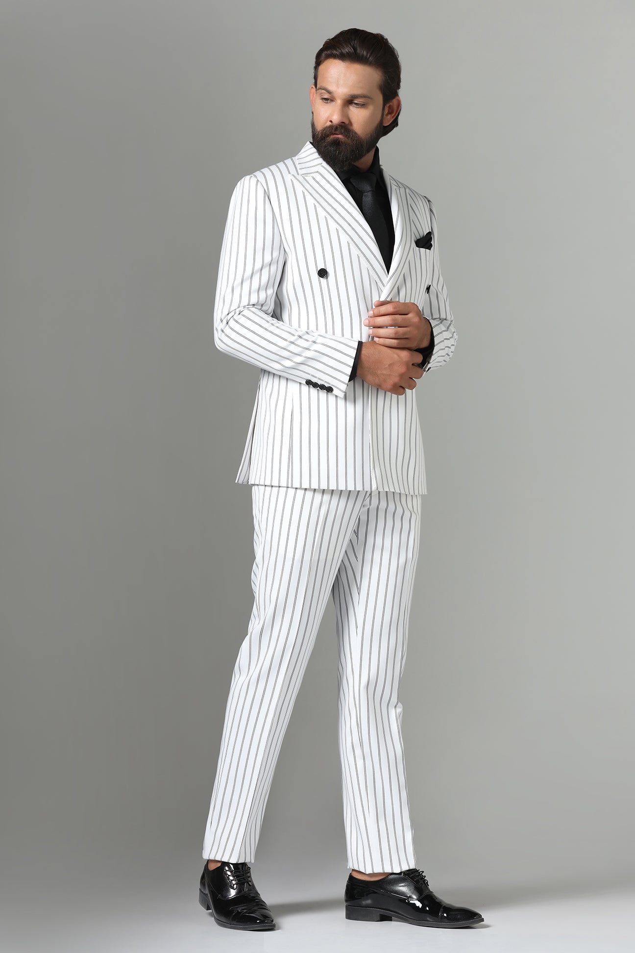Make a statement in our bold White double-breasted suit. Shop Now!