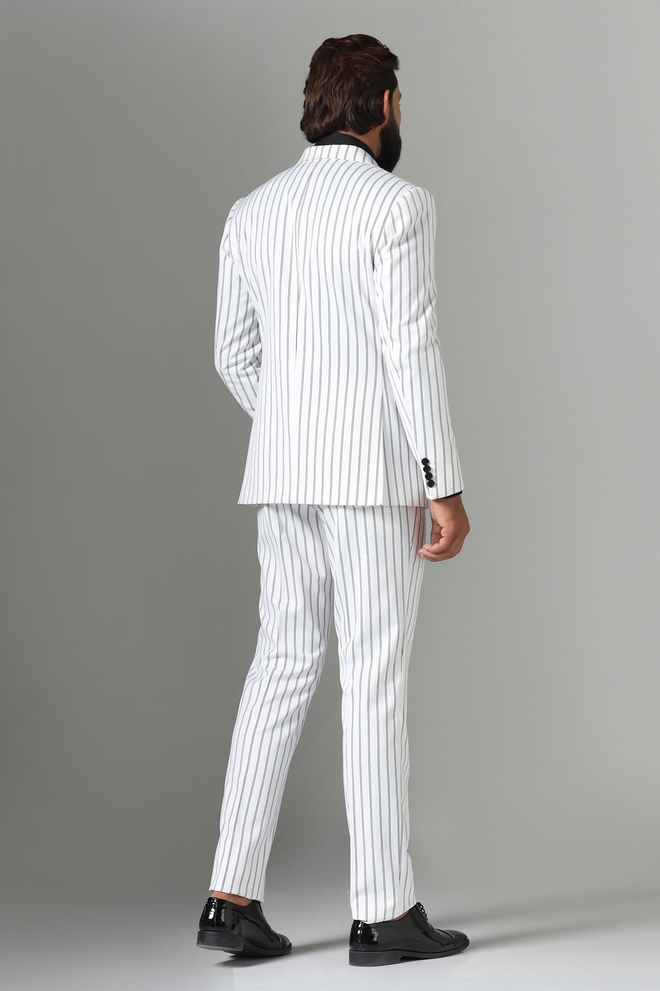 Make a statement in our bold White double-breasted suit. Shop Now!