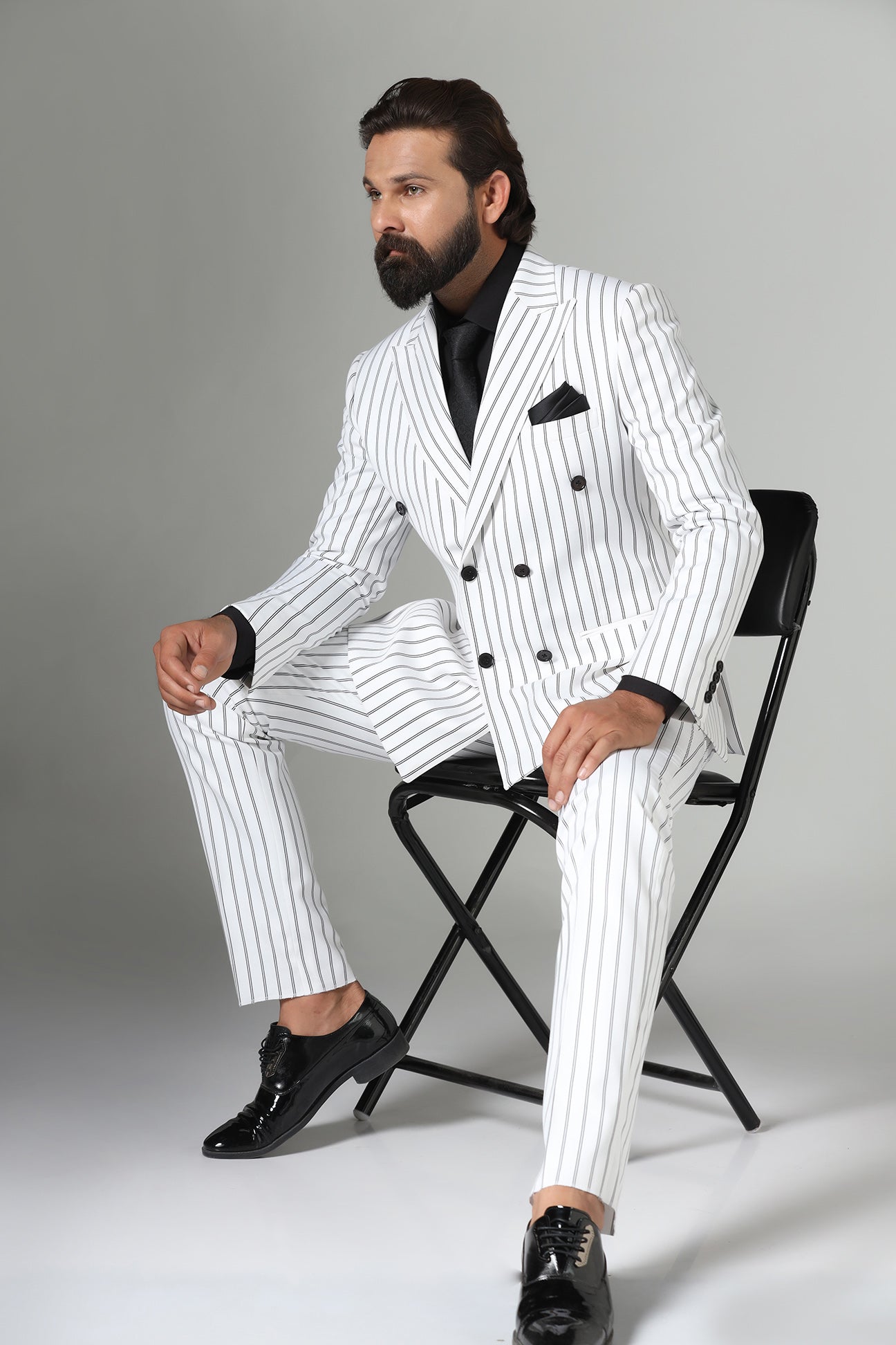 Make a statement in our bold White double-breasted suit. Shop Now!