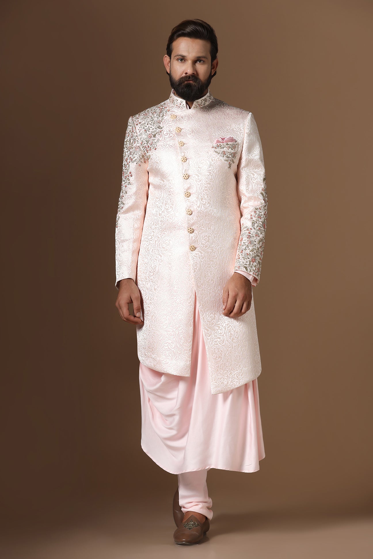 This Indowestern is highlighted by panelled embroidery across the shoulder and sleeve. Shop Now!