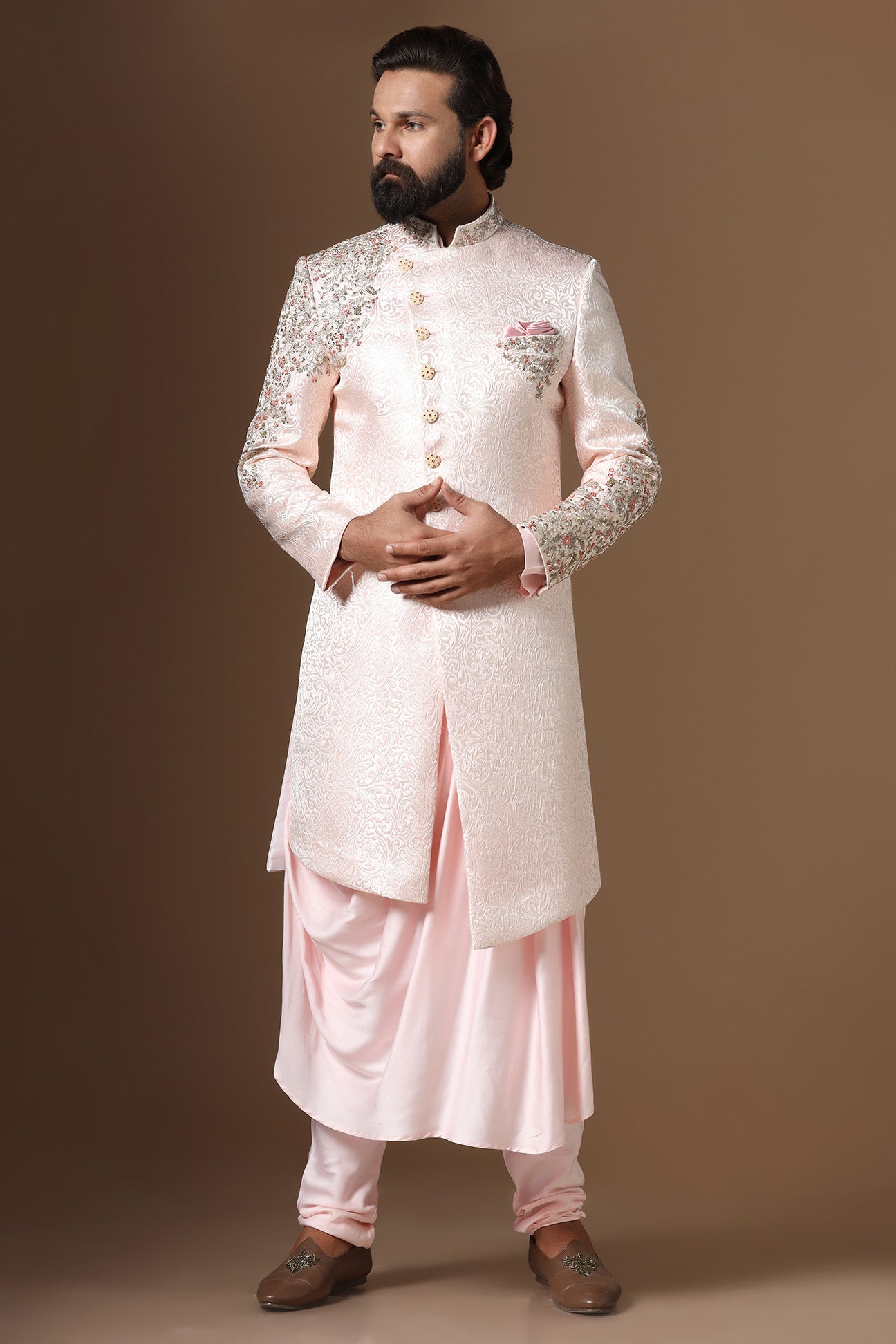 This Indowestern is highlighted by panelled embroidery across the shoulder and sleeve. Shop Now!