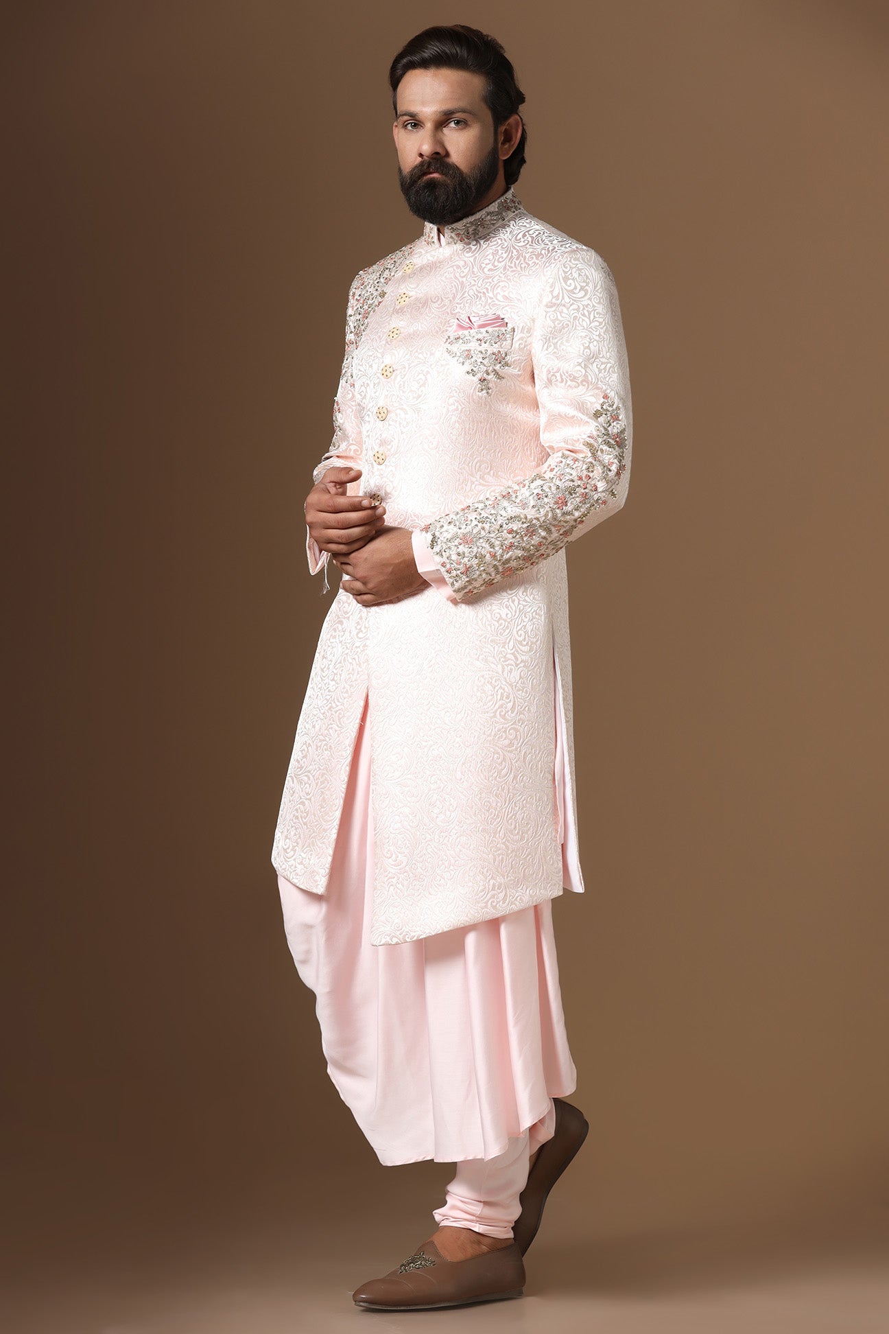 This Indowestern is highlighted by panelled embroidery across the shoulder and sleeve. Shop Now!