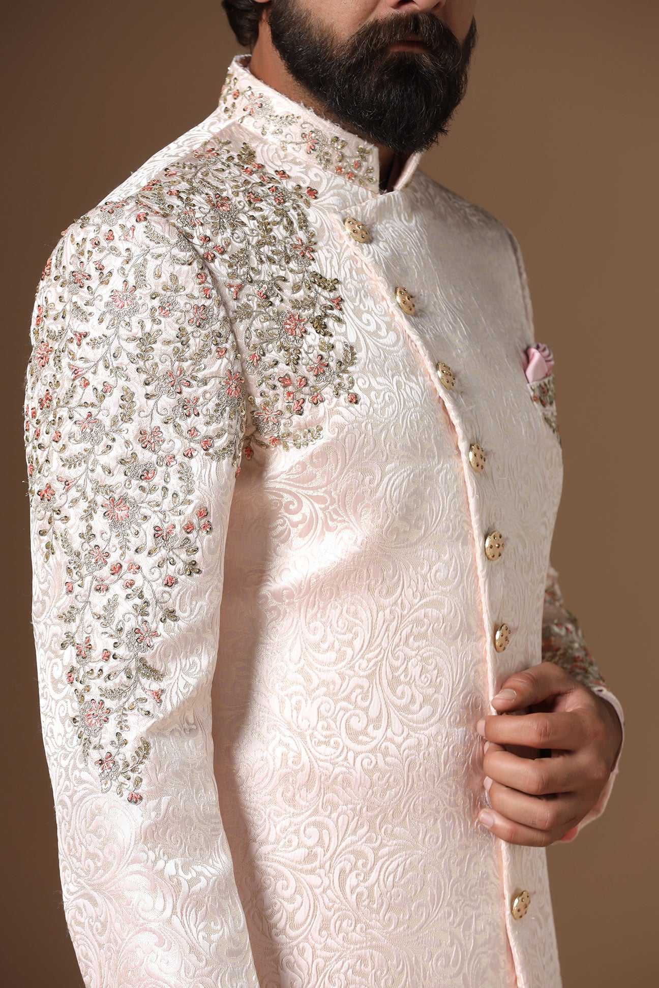 This Indowestern is highlighted by panelled embroidery across the shoulder and sleeve. Shop Now!