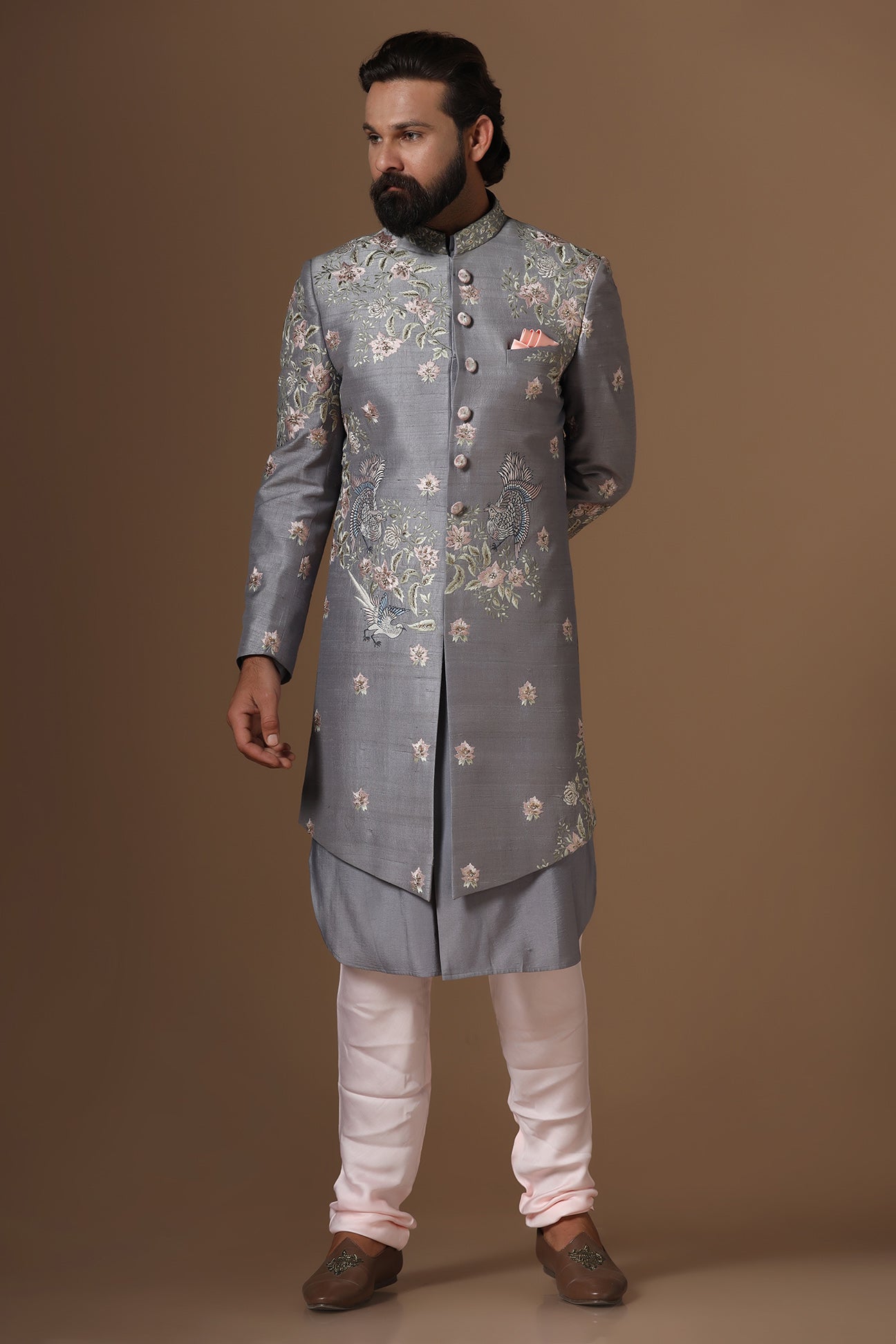 This grey Indowestern is highlighted with floral motif embroidery. Shop Now!