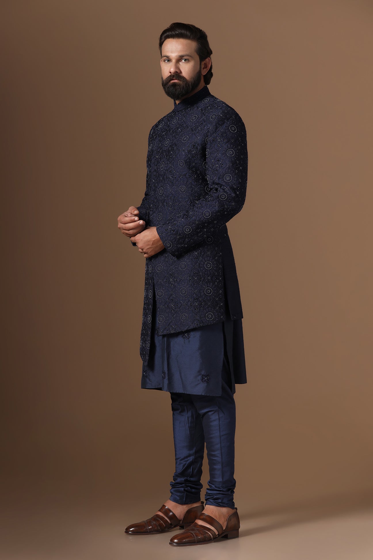 This asymmetric navy blue Indowestern is highlighted with embroidery. Shop Now!
