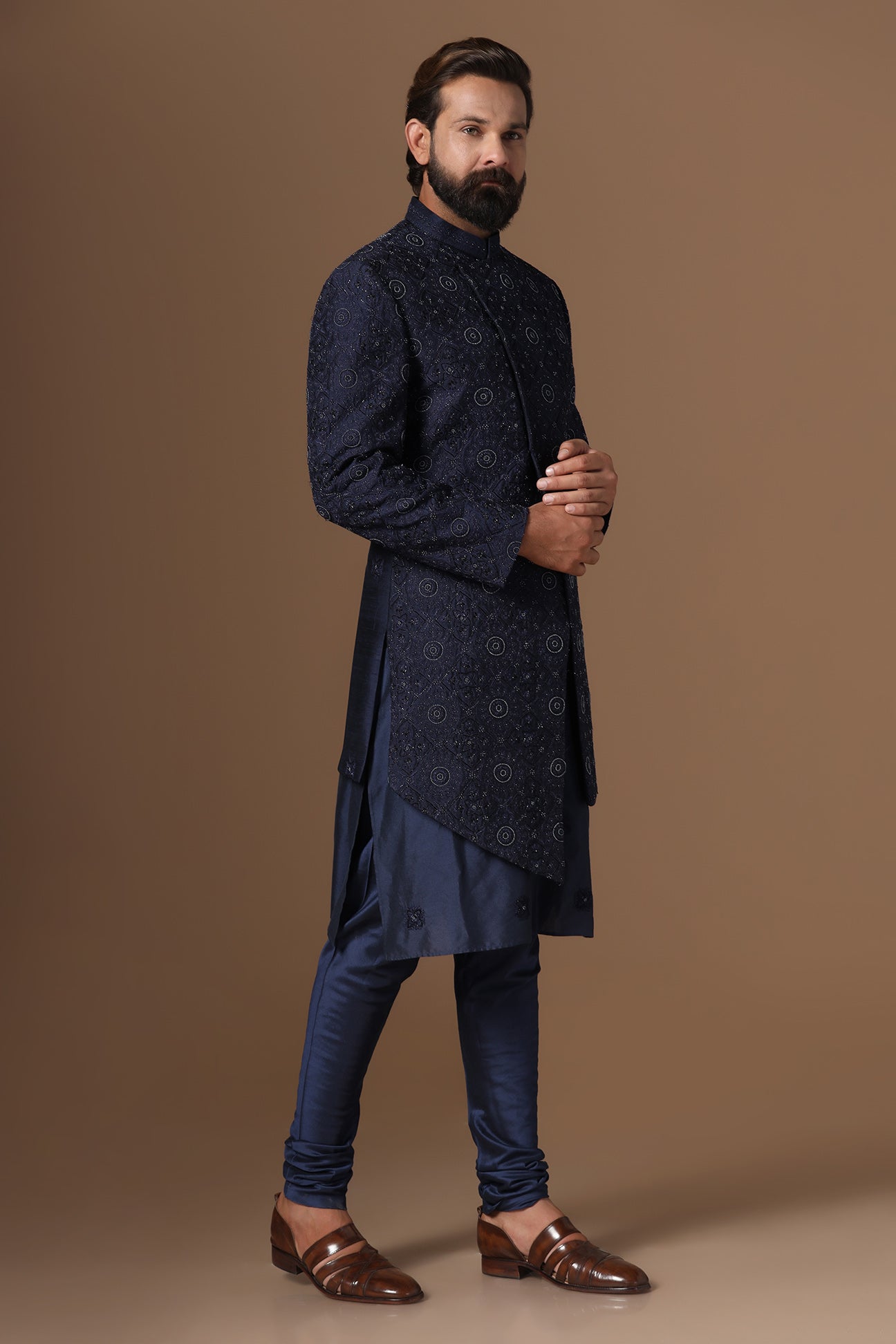 This asymmetric navy blue Indowestern is highlighted with embroidery. Shop Now!