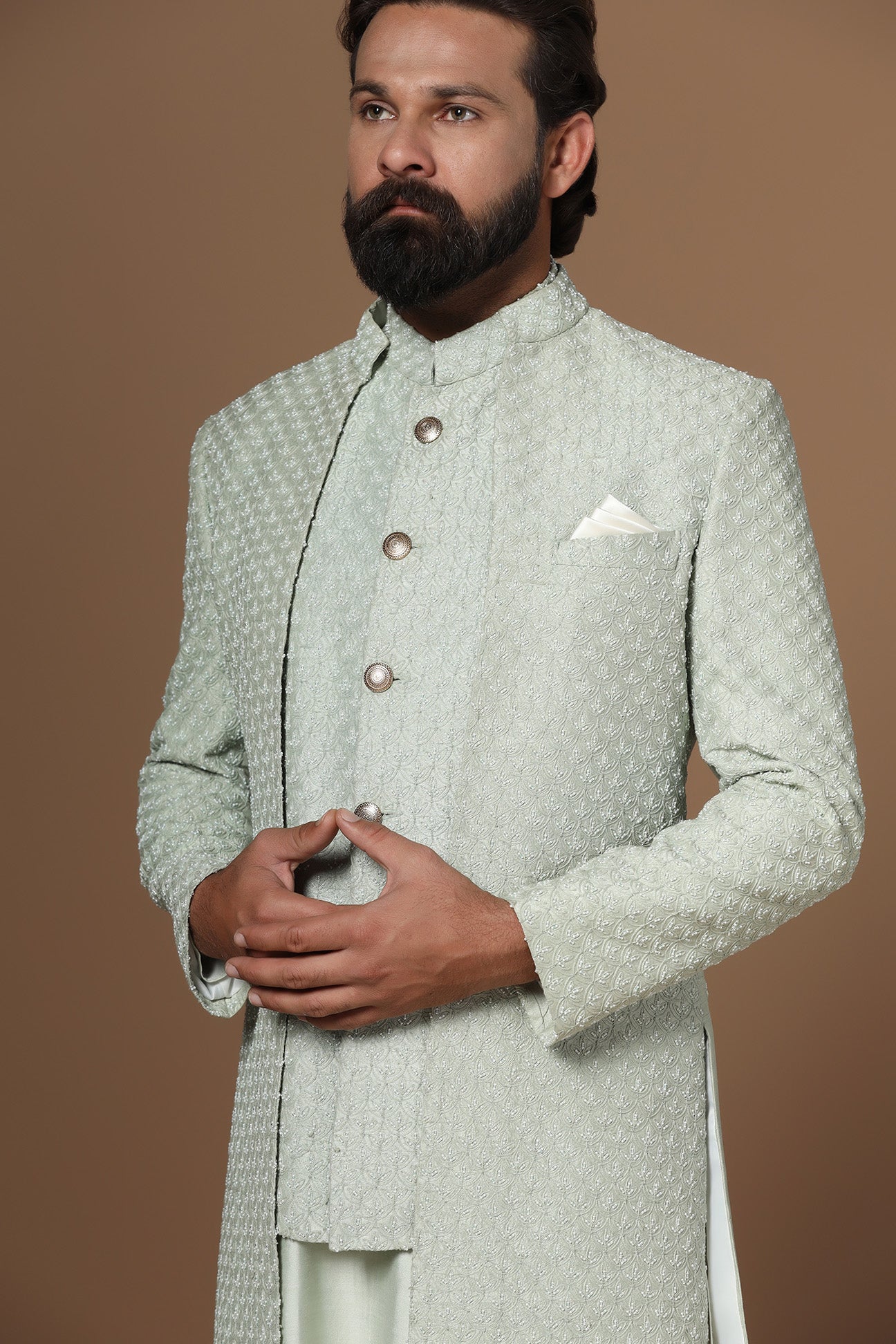 This pistachio green Indowestern is highlighted with overall embroidery across the body. Shop Now!